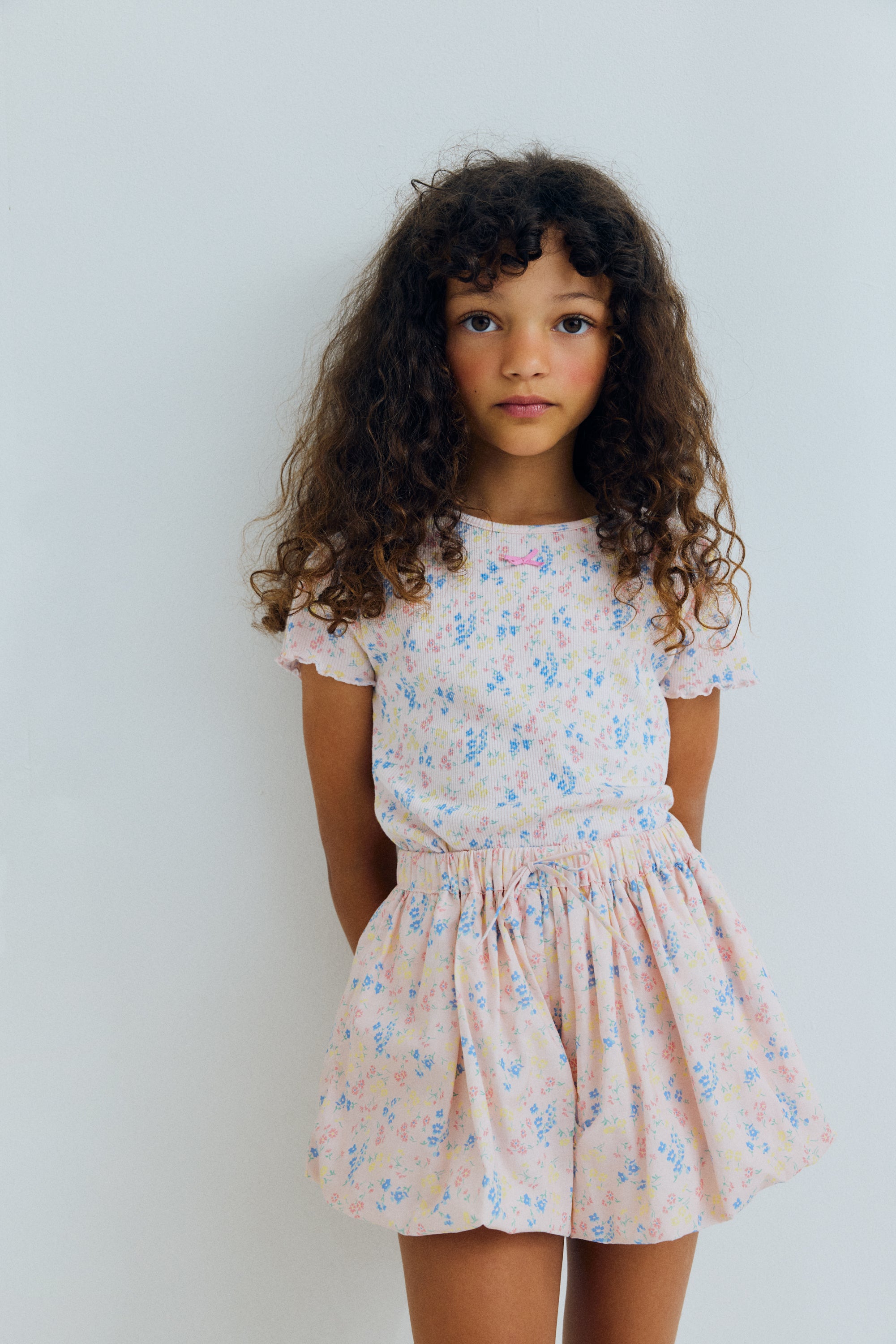 Organic cotton shorts with a beautiful floral print and a balloon style silhouette, creating a playful and distinctive shape.