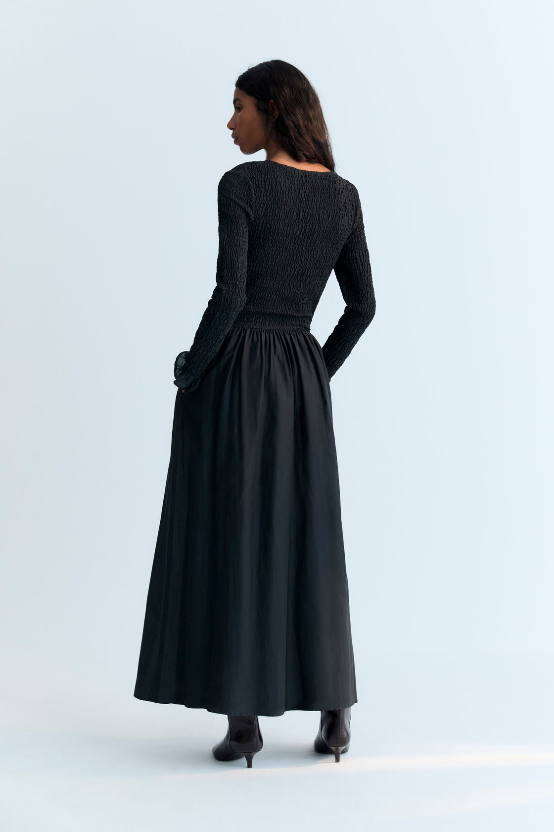 One of our best-selling dress styles, made from high-quality cambric fabric with a smocked bodice and V-neckline. Available in two colors.