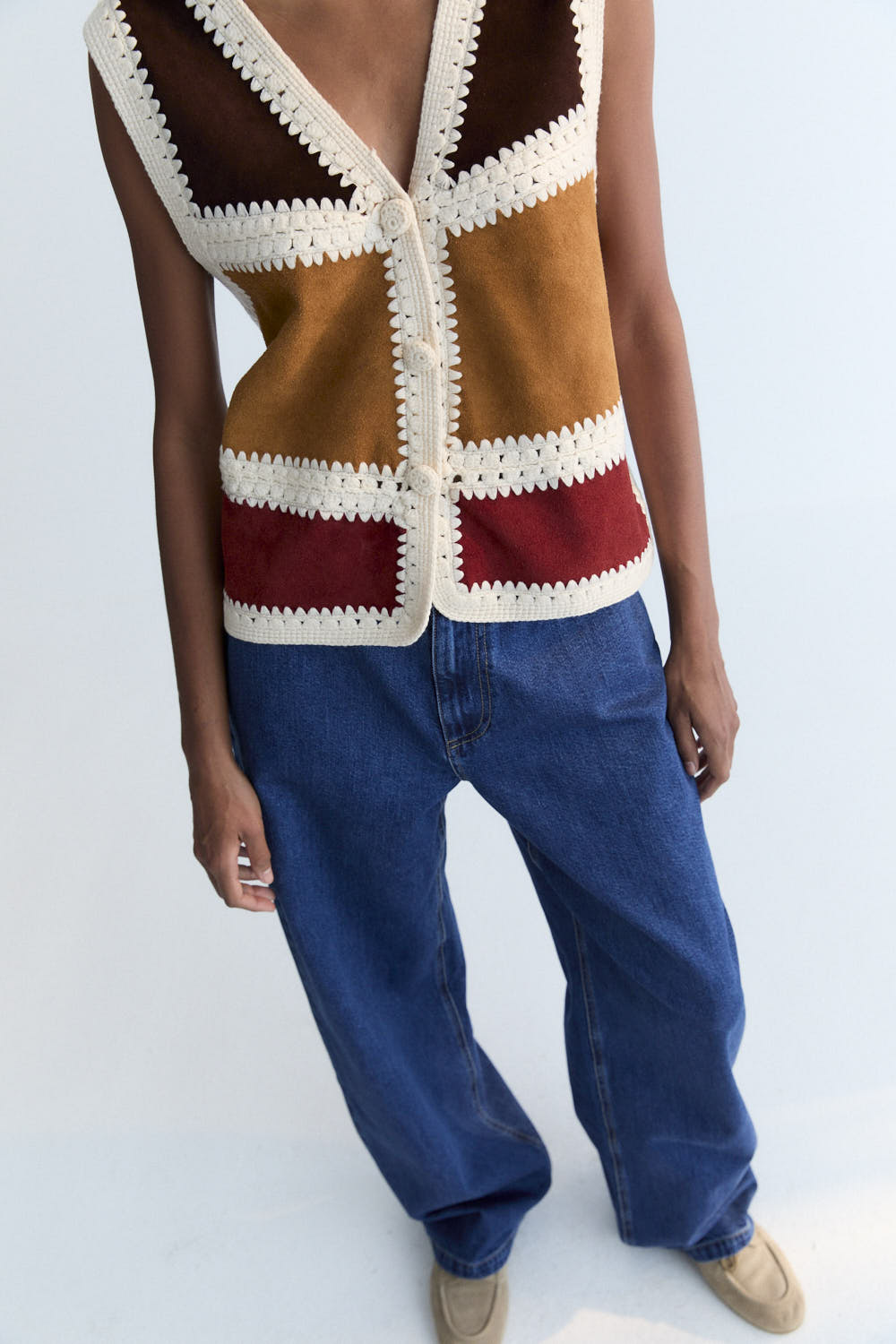 This vest is a special piece made in Spain, crafted from leather in various colors and handwoven wool crochet. A perfect piece to pair with the matching skirt.