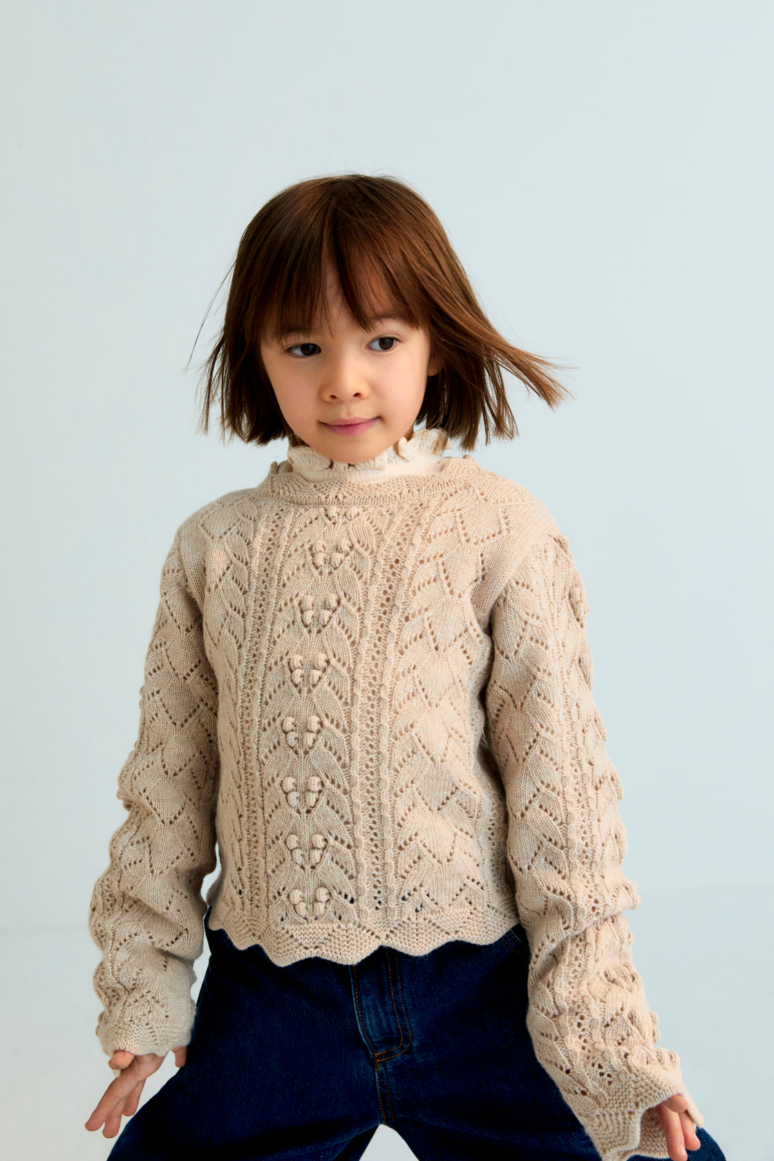 Soft and refined, this knit sweater in Moonlight White is crafted from a blend of recycled cashmere and wool.