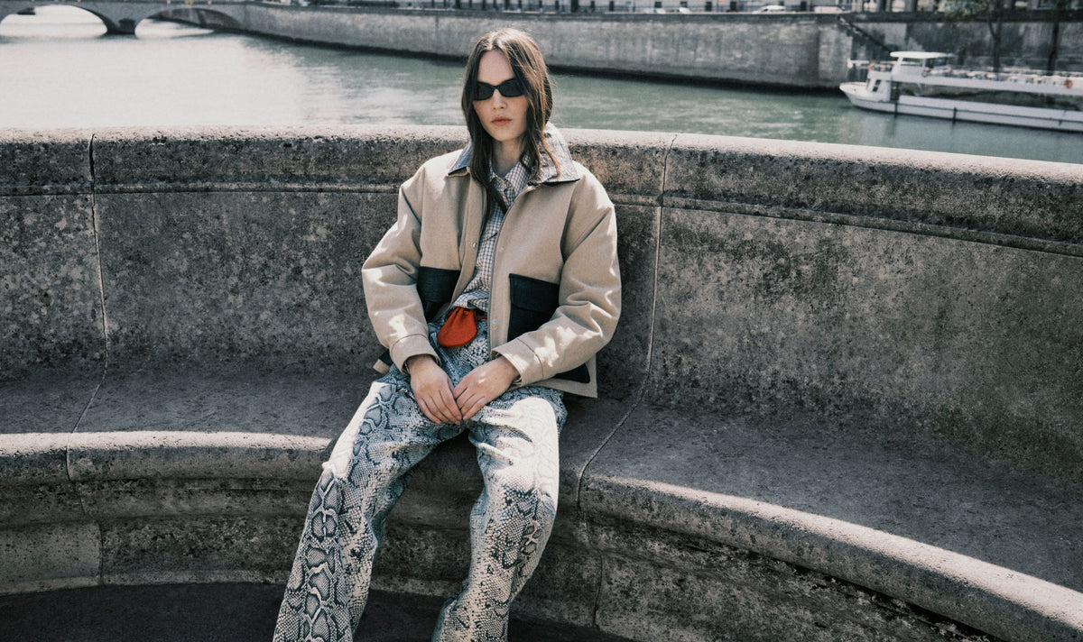 The Flint Woman Jacket is crafted from 100% cotton, offering a structured yet comfortable feel for everyday wear.