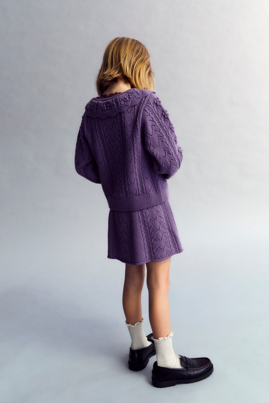 This knit skirt in Grape Bliss combines recycled cashmere and wool for a soft, sustainable fabric blend.