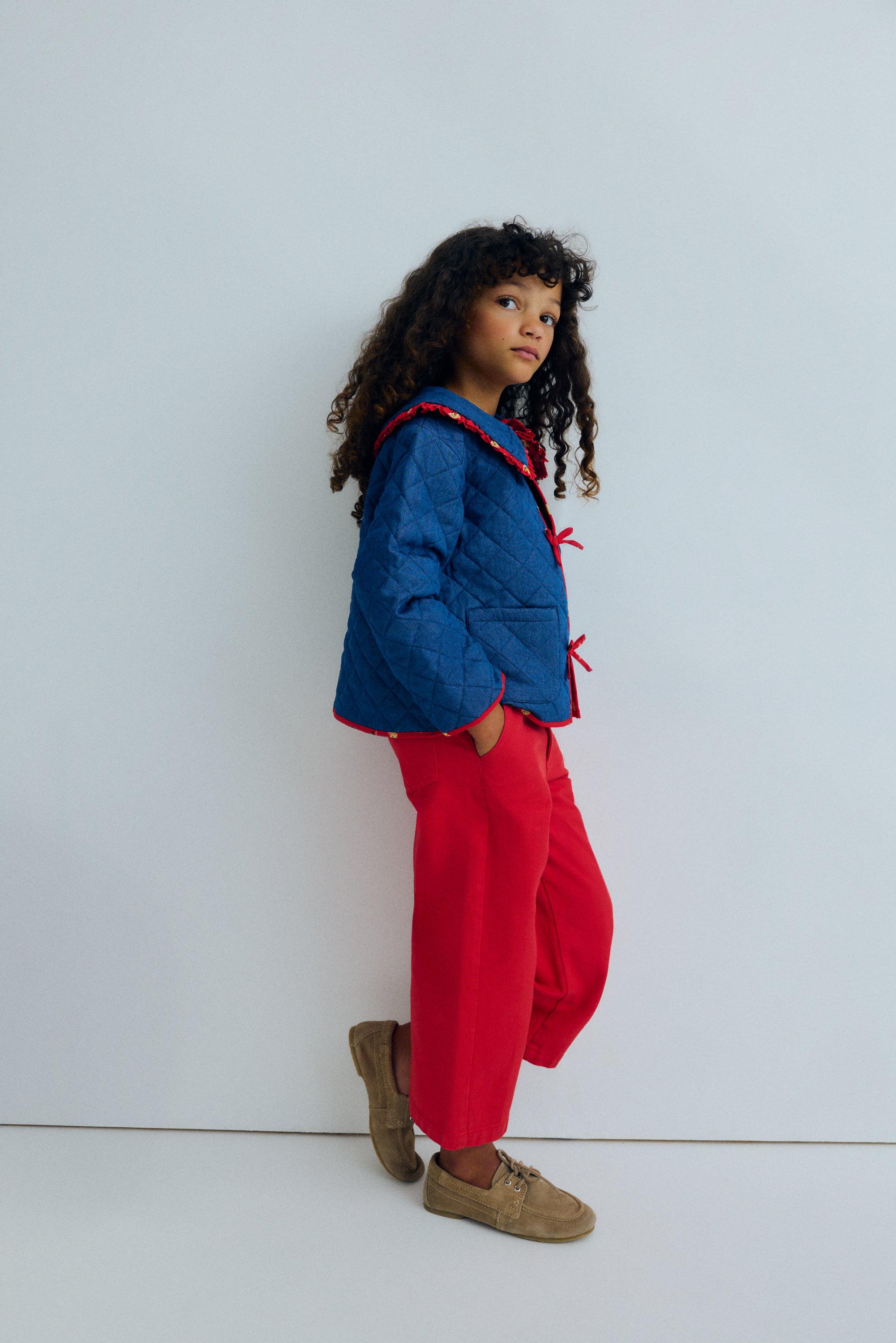 Wide leg denim pants in a vibrant red, featuring straight legs and an adjustable waistband with interior elastic