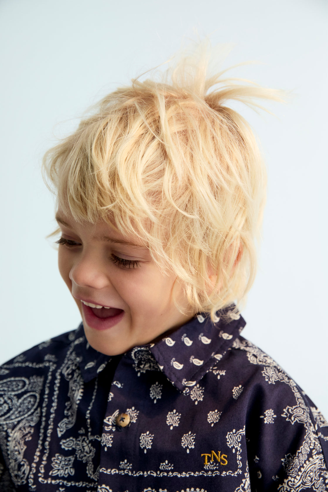 This navy flannel shirt features a distinctive bandana print and contrasting TNS embroidery on the chest for a stylish, urban look