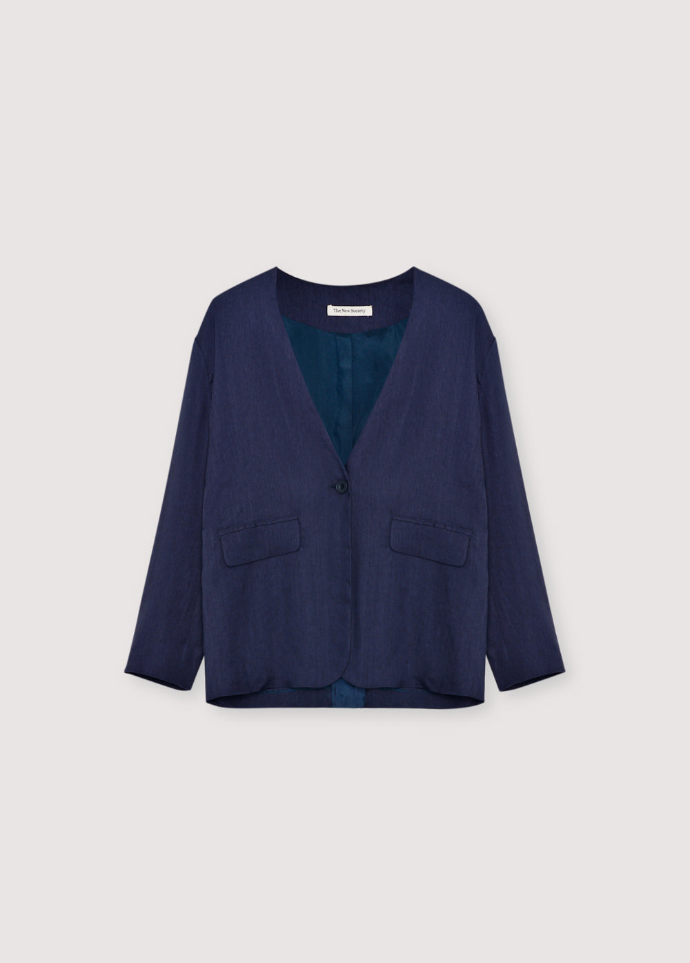 Linen and viscose blazer made in our workshops in Spain. Features a front opening with a notched collar, tone - on-tone button closure, and two front pockets.