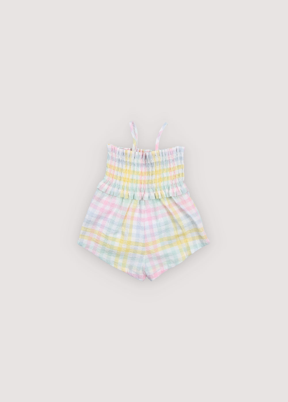 Mono para bebé confeccionado en tejido seersucker de algodón con un encantador estampado de cuadros de colores.