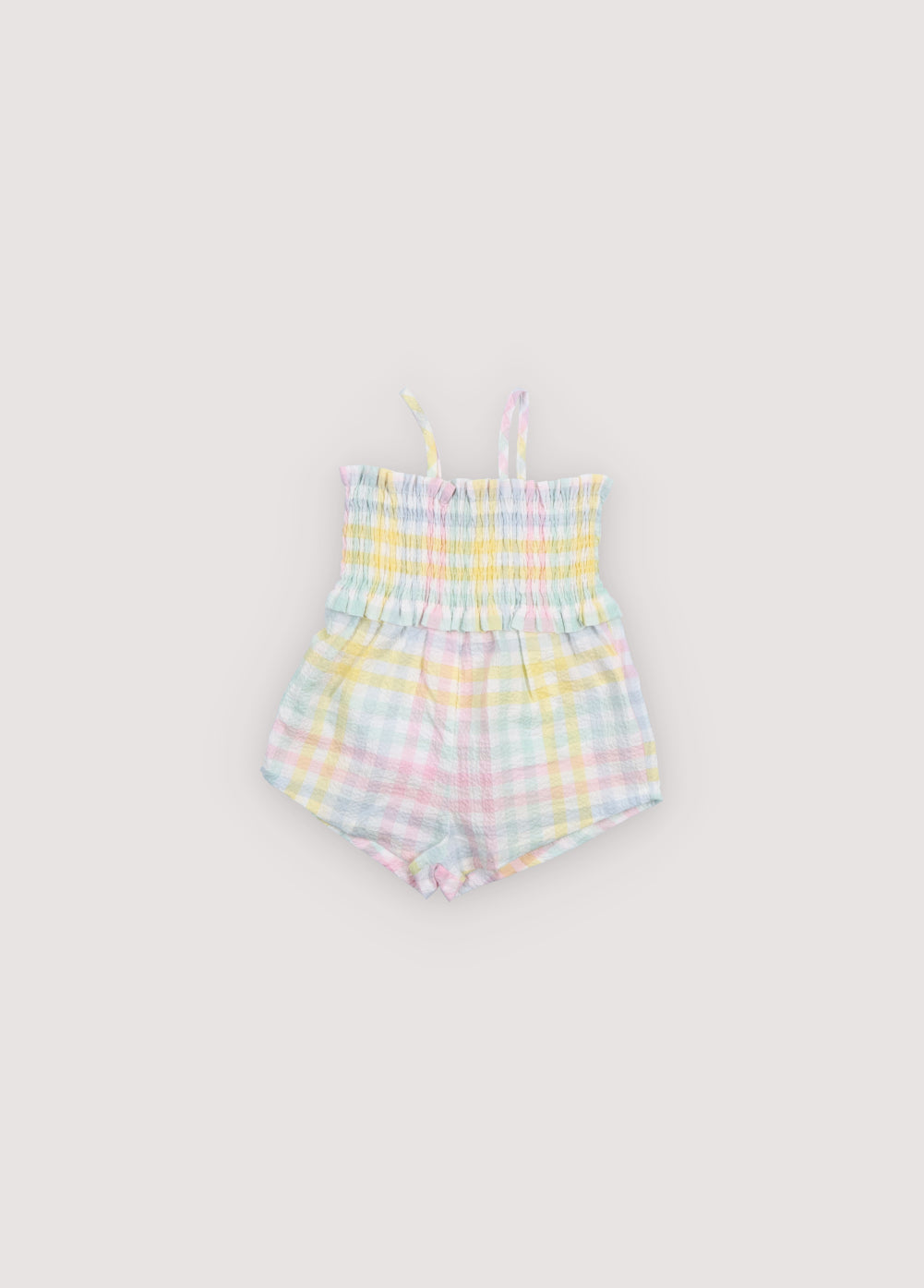 Mono para bebé confeccionado en tejido seersucker de algodón con un encantador estampado de cuadros de colores.