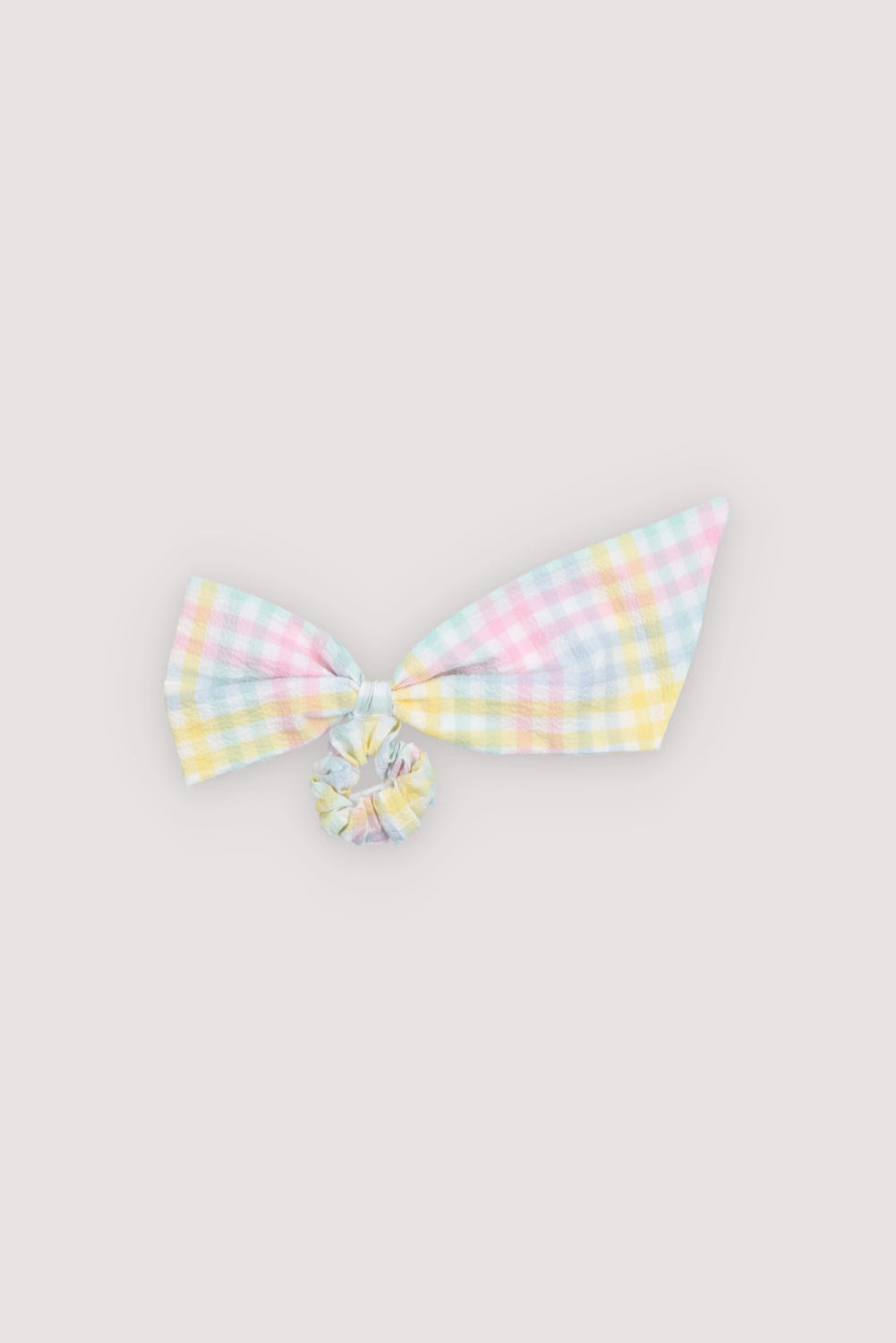 Scrunchie made from soft seersucker fabric in colorful checks with an elasticated interior for a secure fit.