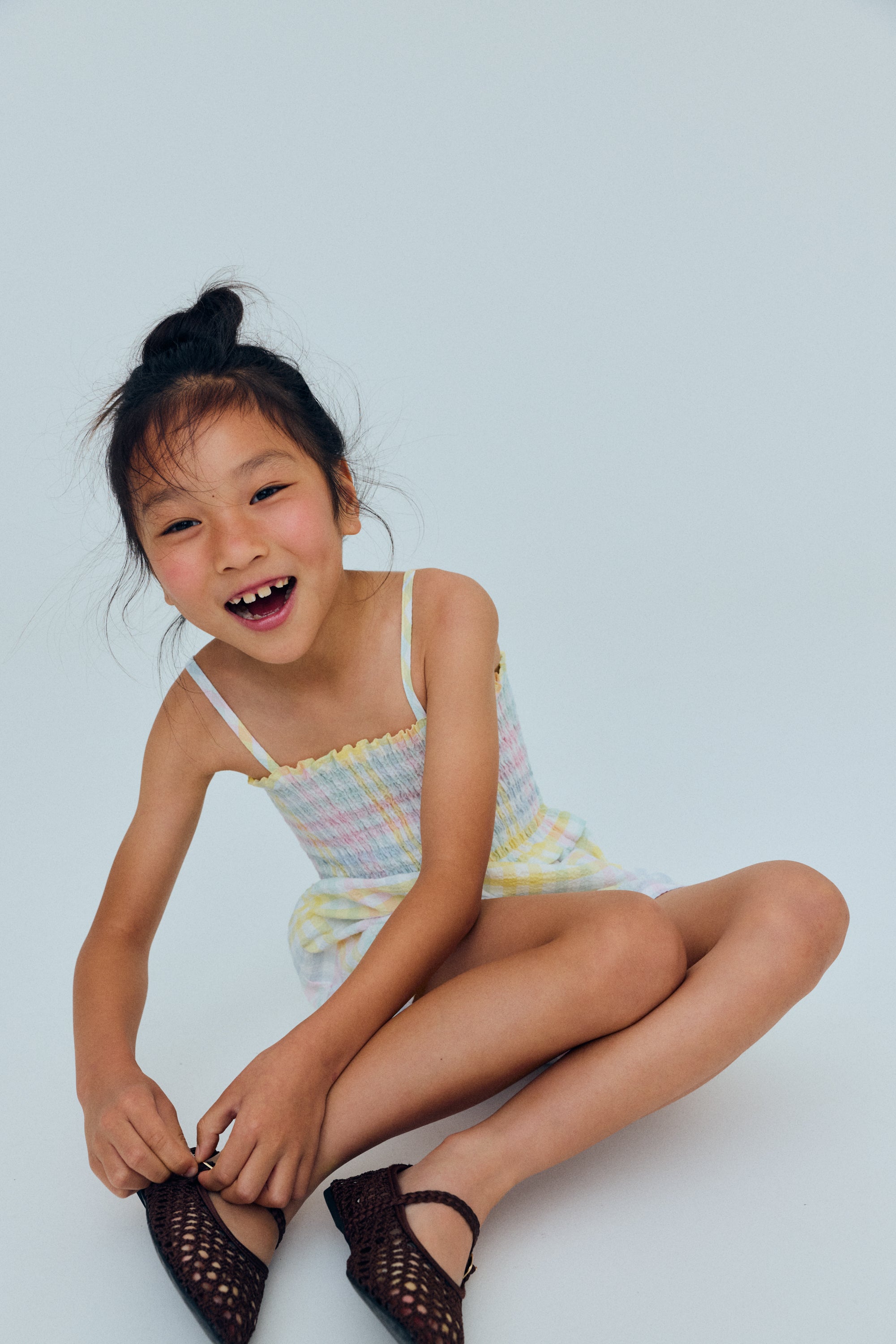 Cotton jumpsuit in lightweight seersucker fabric with a pretty colorful check pattern.