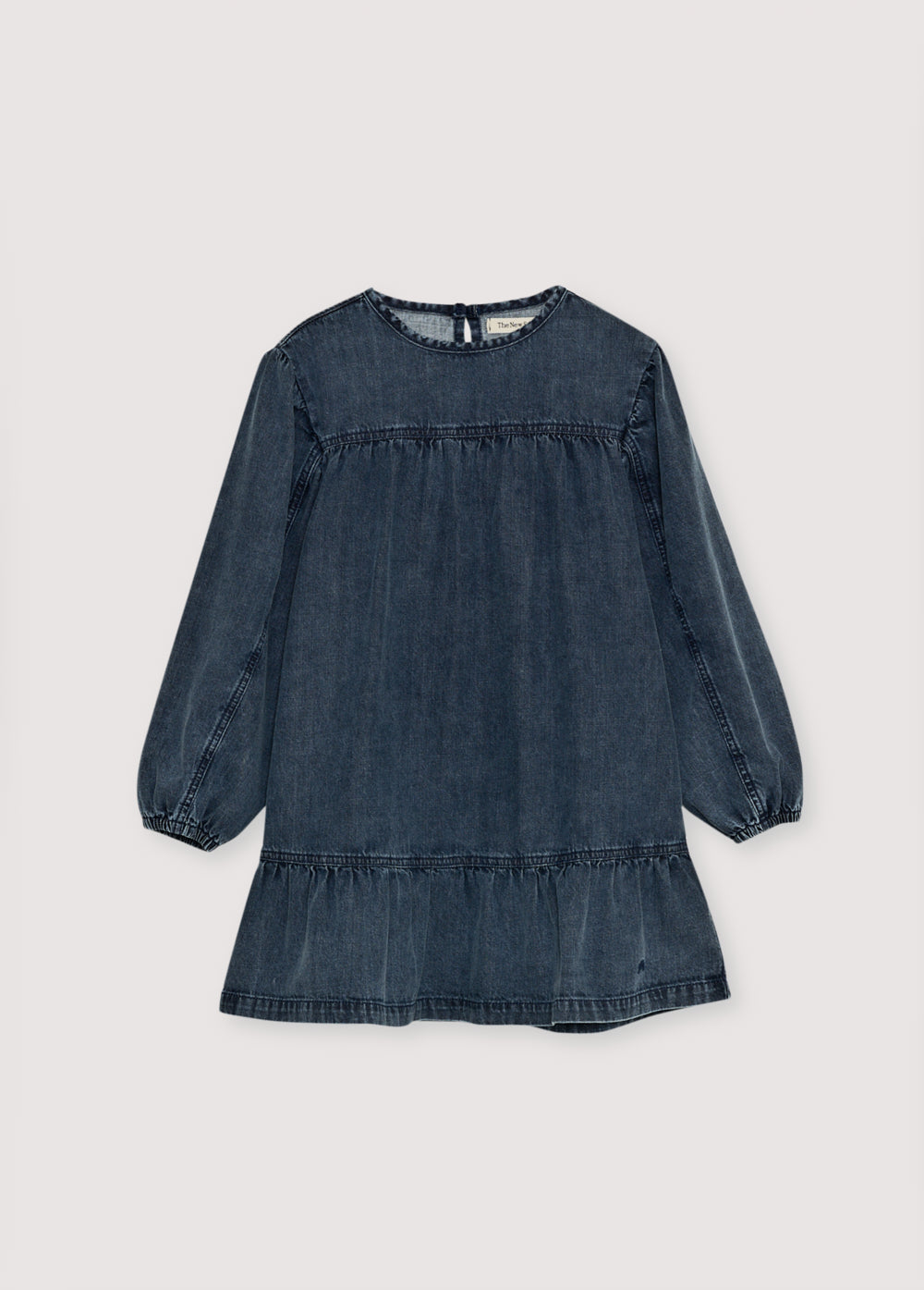 Short washed dark denim dress featuring puffed sleeves and a back cut-out detail. TNS embroidery.