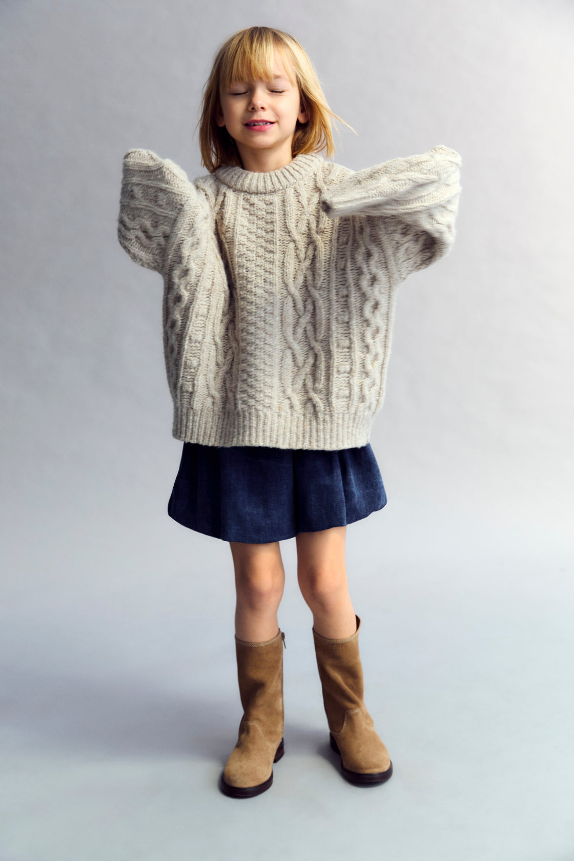 Short washed dark denim bubble skirt with an elastic waistband.