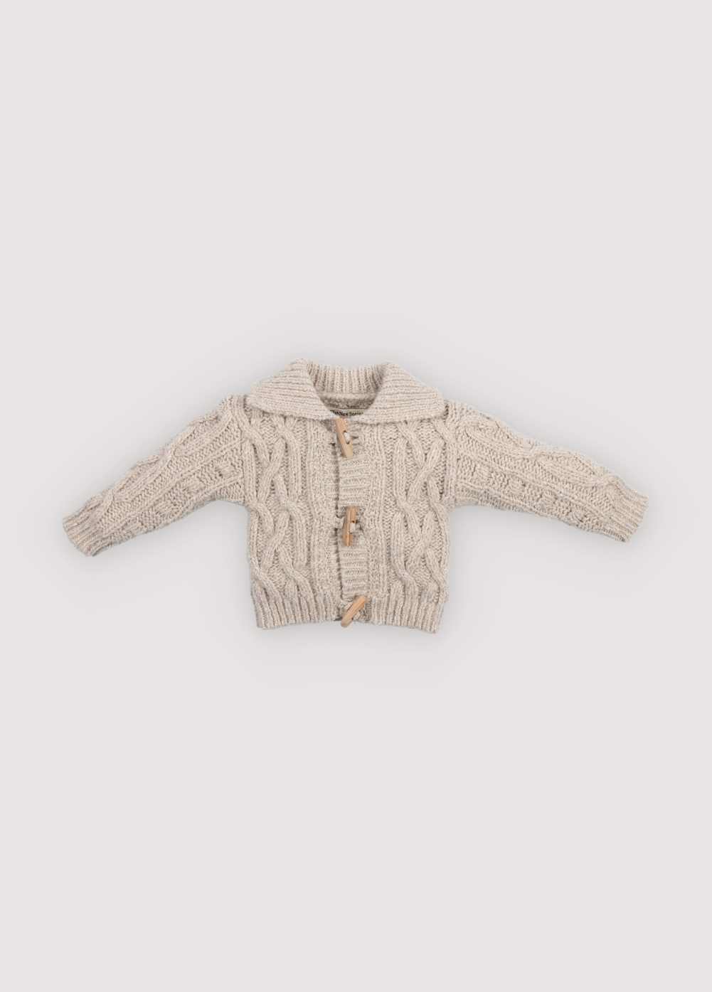 Knitted cardigan with a ribbed neckline, cuffs, and hem. Features a front opening with wooden toggles. Comes with matching knit pants to complete the look. Made with high-quality recycled materials.