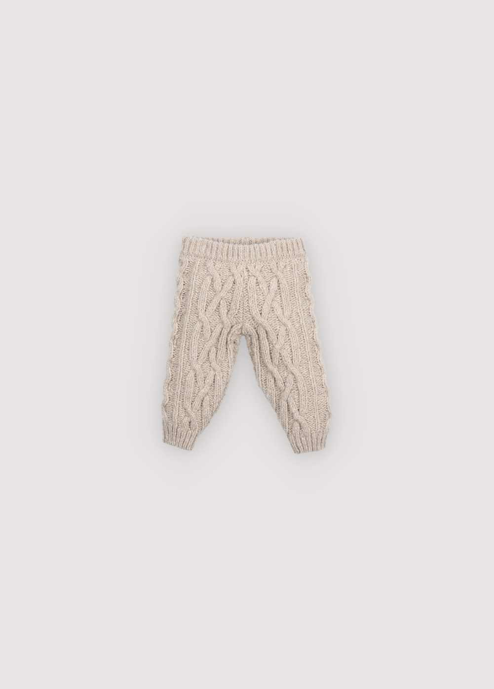 Knitted pants with a ribbed waistband and cuffs. Comes with a matching cardigan to complete the look. Made with high-quality recycled materials.