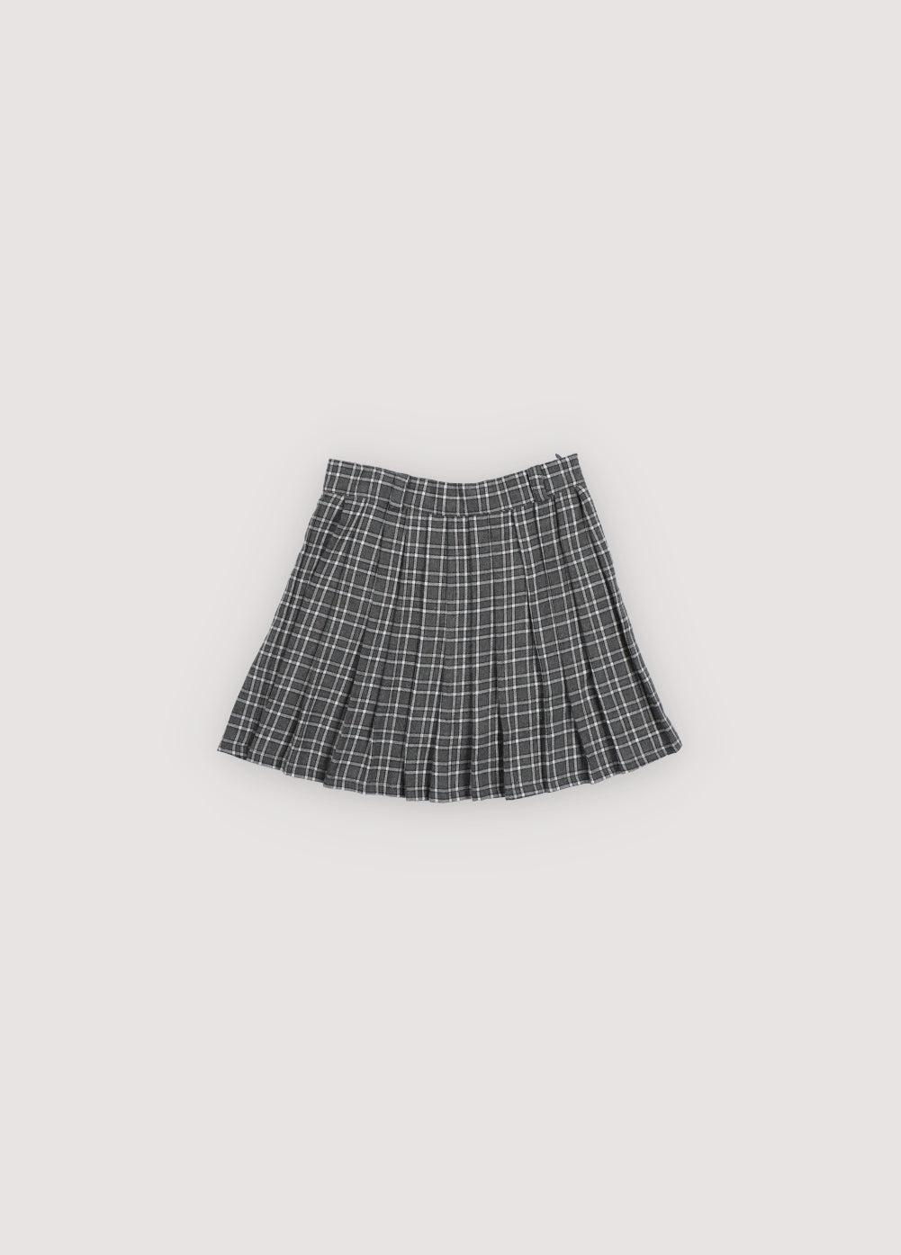 A chic pleated skirt featuring a comfortable inner pant lining for ease of movement. Designed with a fitted waistband, belt loops, and a tonal side zipper for a clean, refined finish.