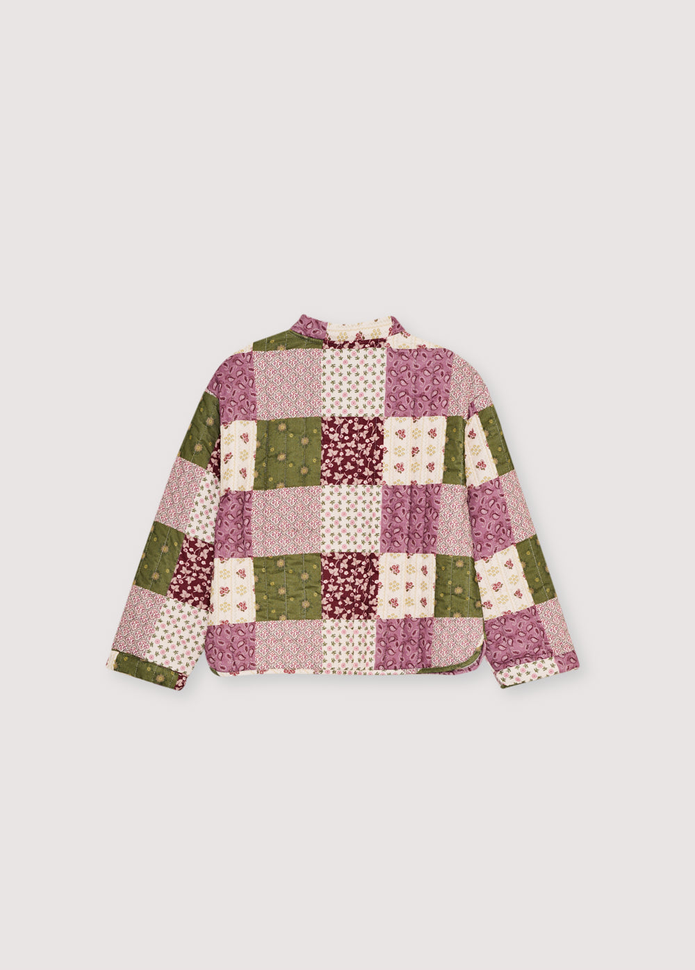 Quilted micro-corduroy jacket with a unique patchwork print, featuring a tie closure and button at the front.