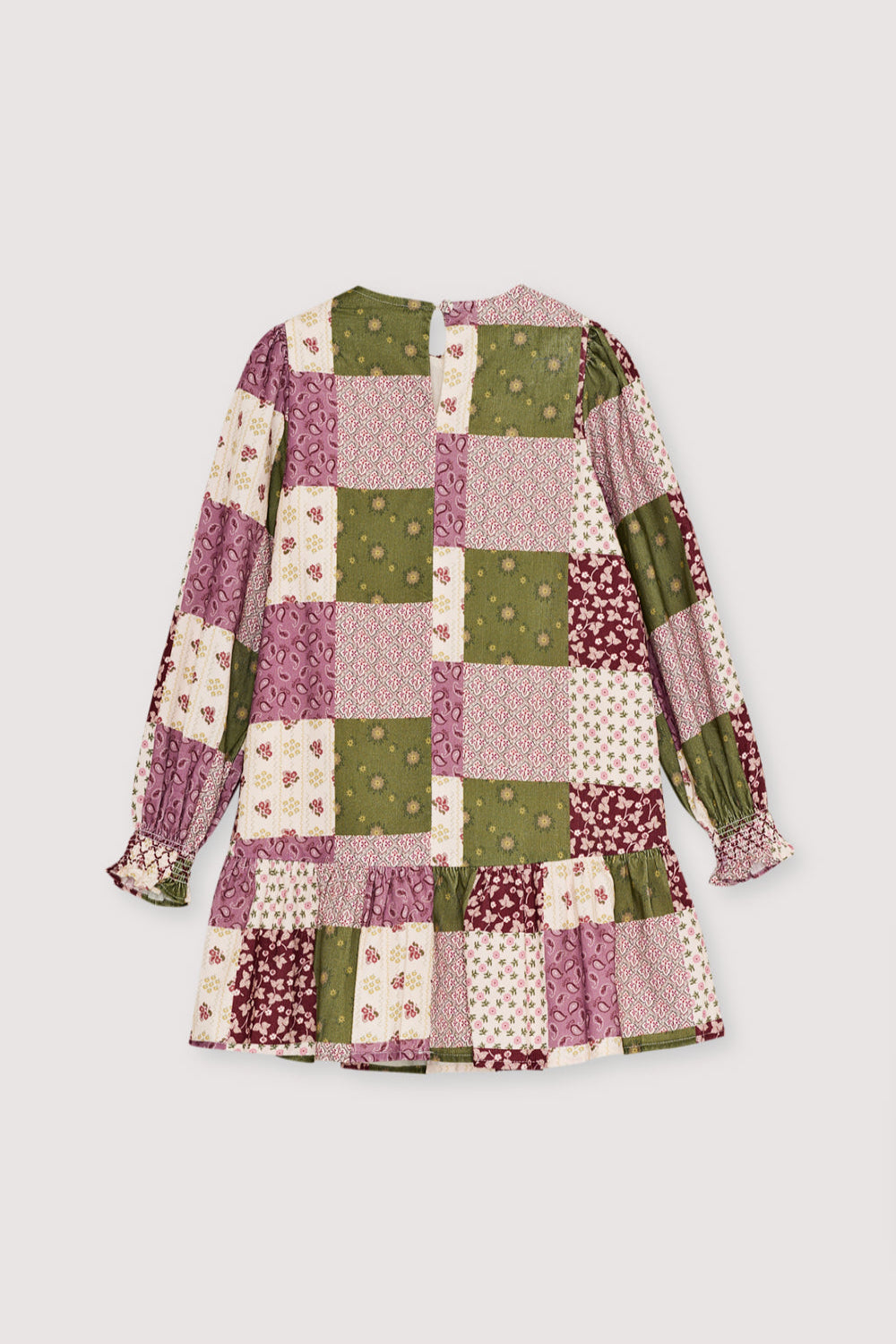 This charming dress features a unique patchwork print, puffed sleeves, and a ruffled skirt.