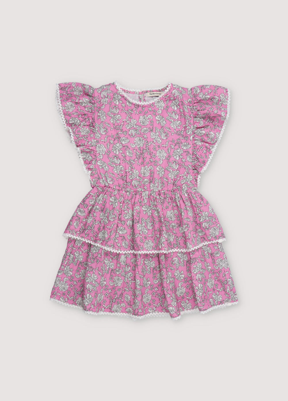 Melina Dress in 100% cotton muslin with our peony hibiscus print. The dress features ruffles on the sleeves, a high neckline, and lace detail on the neckline and shoulder ruffle, with a voluminous skirt.
The New Society