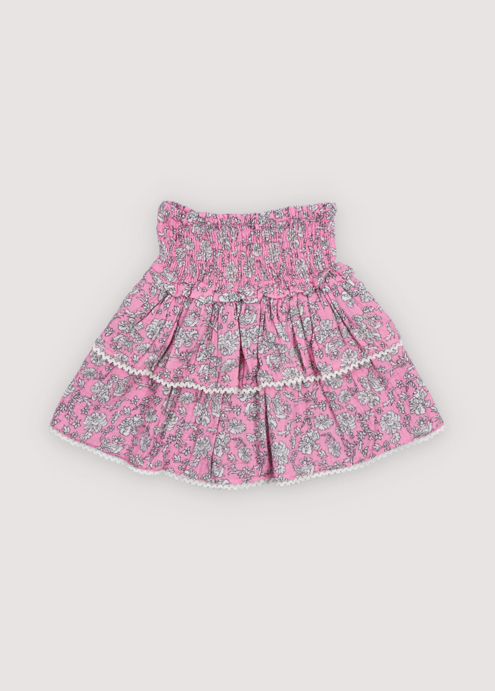 Melina Skirt in 100% cotton muslin with our peony hibiscus print. Our iconic skirt with smocking to create volume and two ruffles.