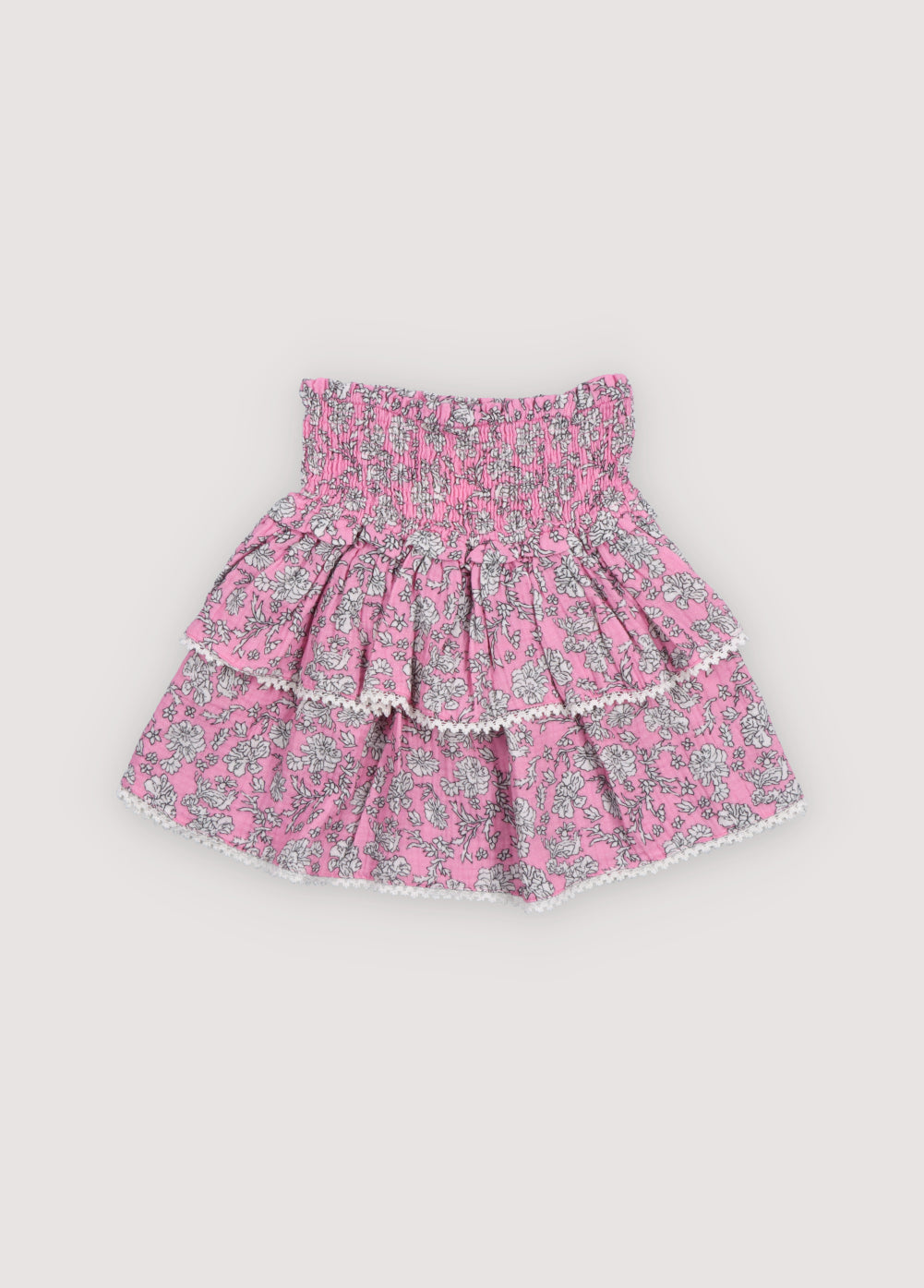 Melina Skirt in 100% cotton muslin with our peony hibiscus print. Our iconic skirt with smocking to create volume and two ruffles.
