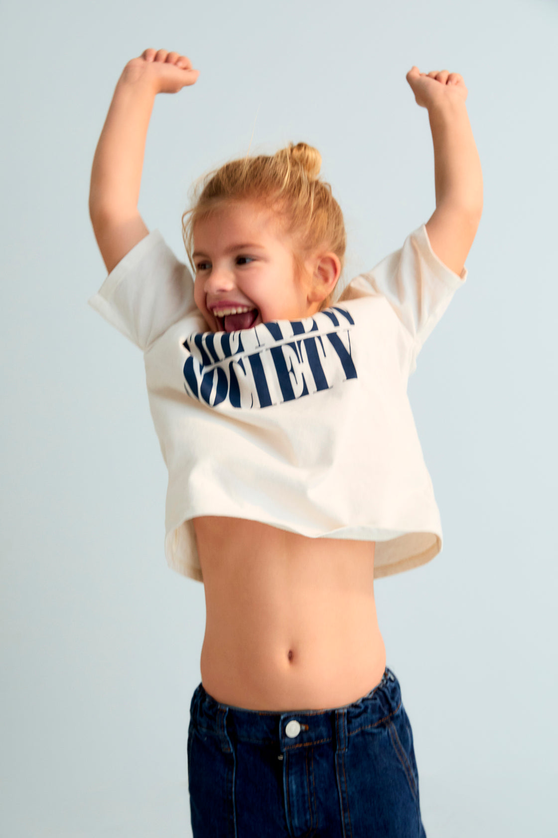 The Moonlight White T-shirt features a bold contrasting "The New Society" logo, designed for a clean and modern look