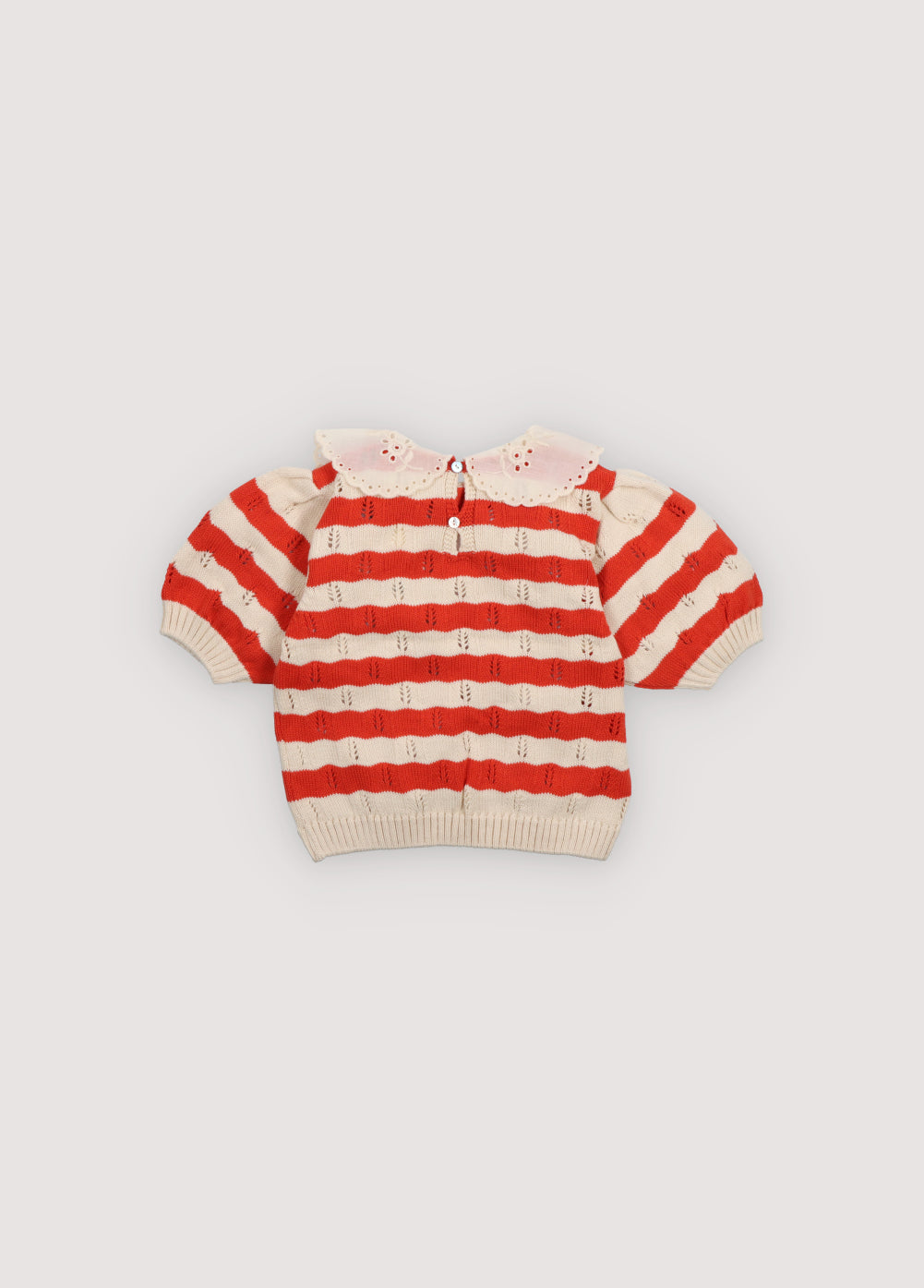 Bicolor striped short-sleeved knit sweater with delicate contrast lace collar detail. It features elastic ribbing at the hem and also elastic cuffs. It's a perfect garment to create a fun total look with the matching pants. Spring Summer Collection. The New Society.