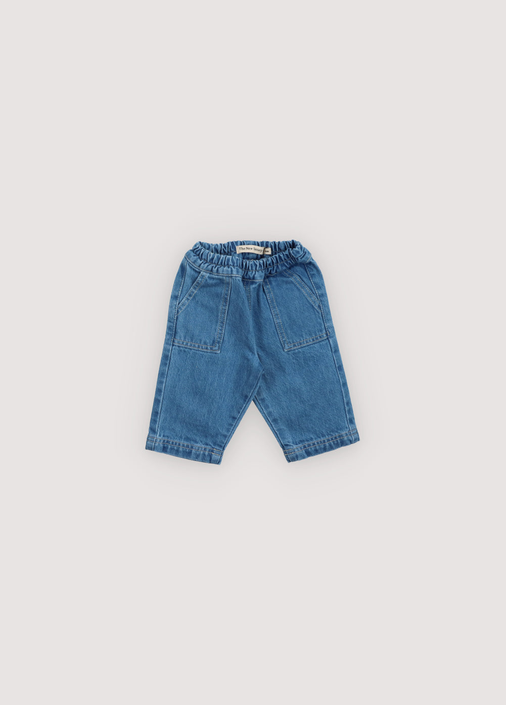 Patch pocket pants, with elastic waistband, and contrasting stitching detail. Spring Summer Collection. The New Society.