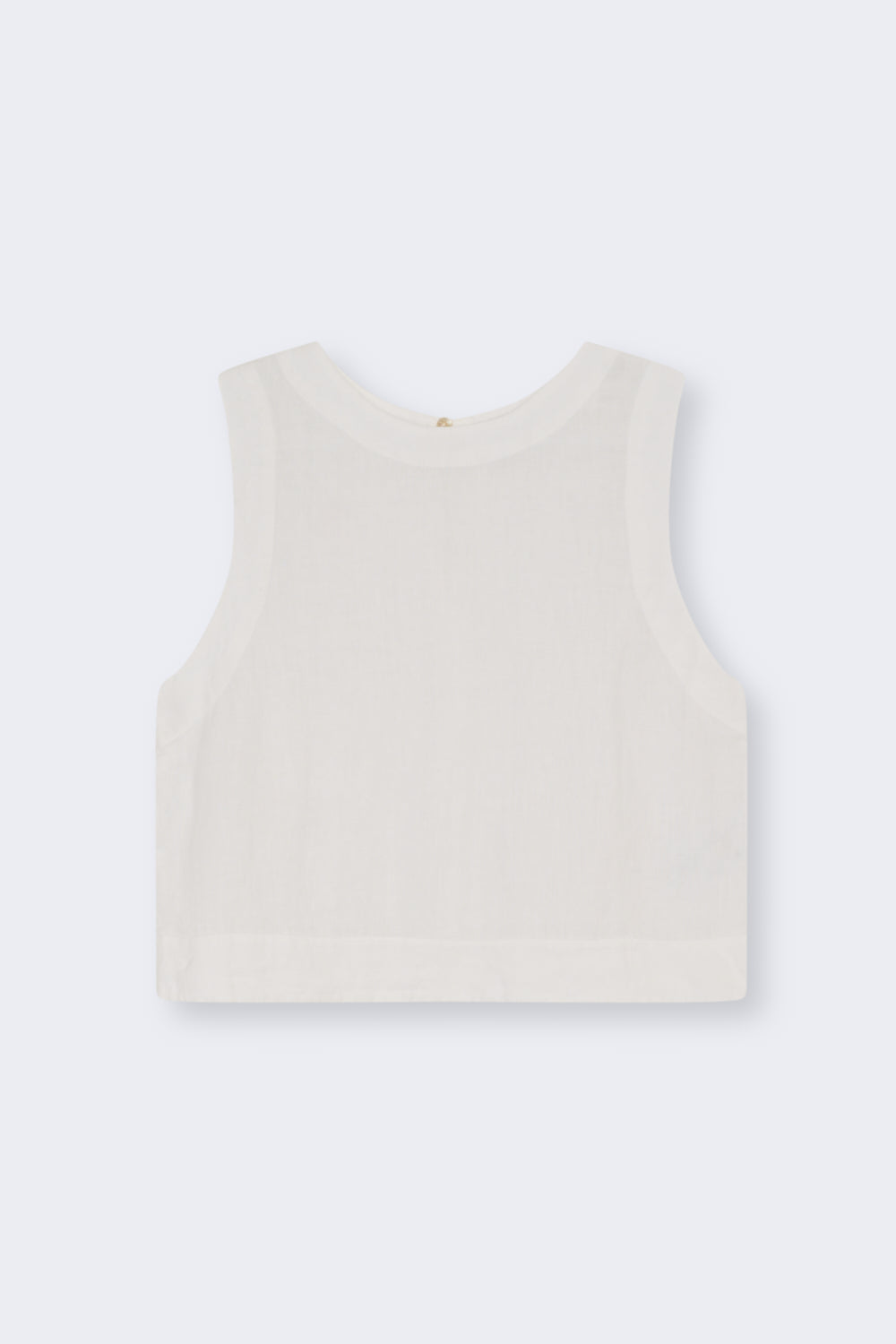 100% linen top made in Portugal with a soft and delicate finish. Features a back keyhole opening with a button closure