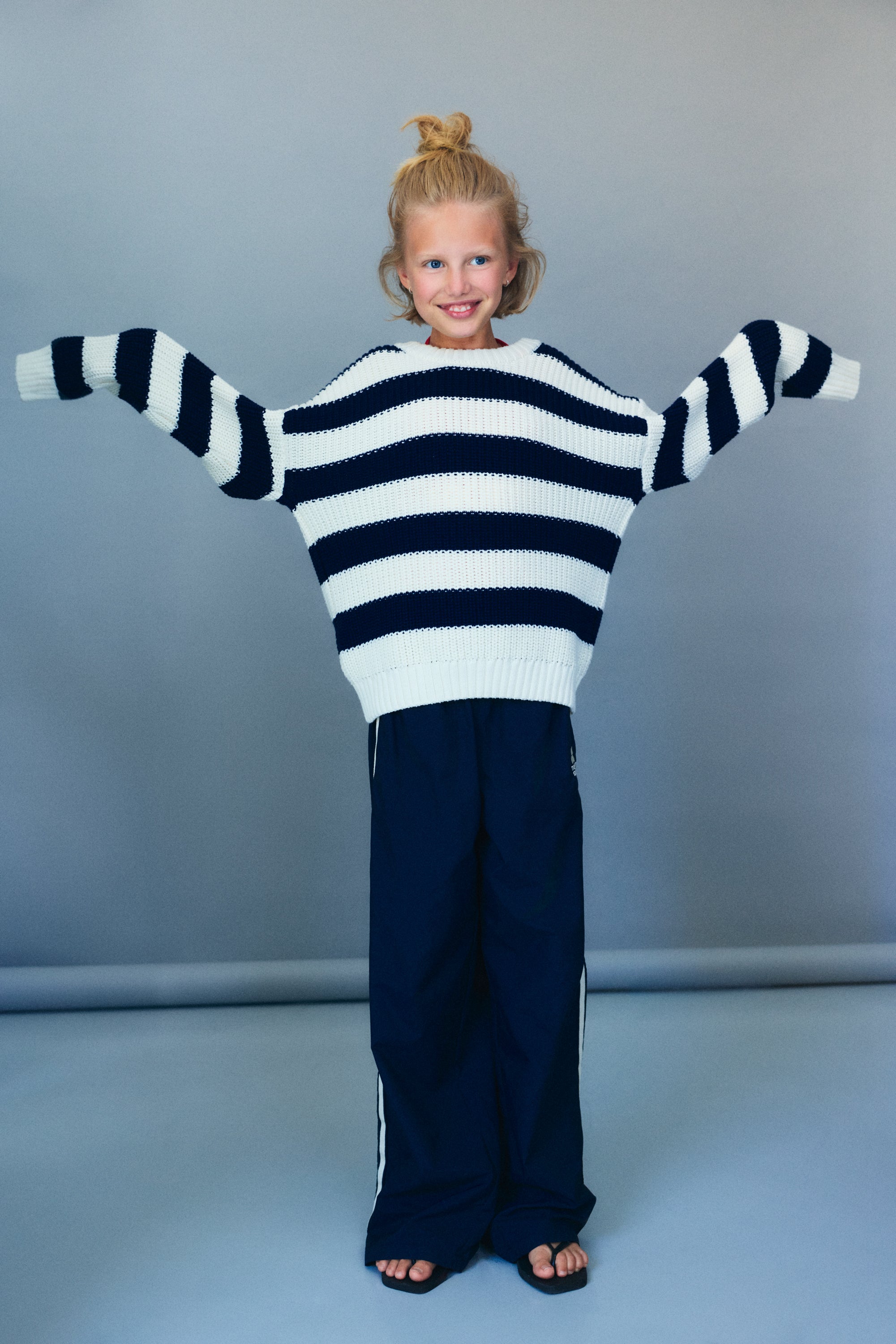 Our classic two tone striped sweater in ribbed cotton knit, featuring ribbed finishes at the neckline, sleeves, and hem for a comfortable, polished fit.