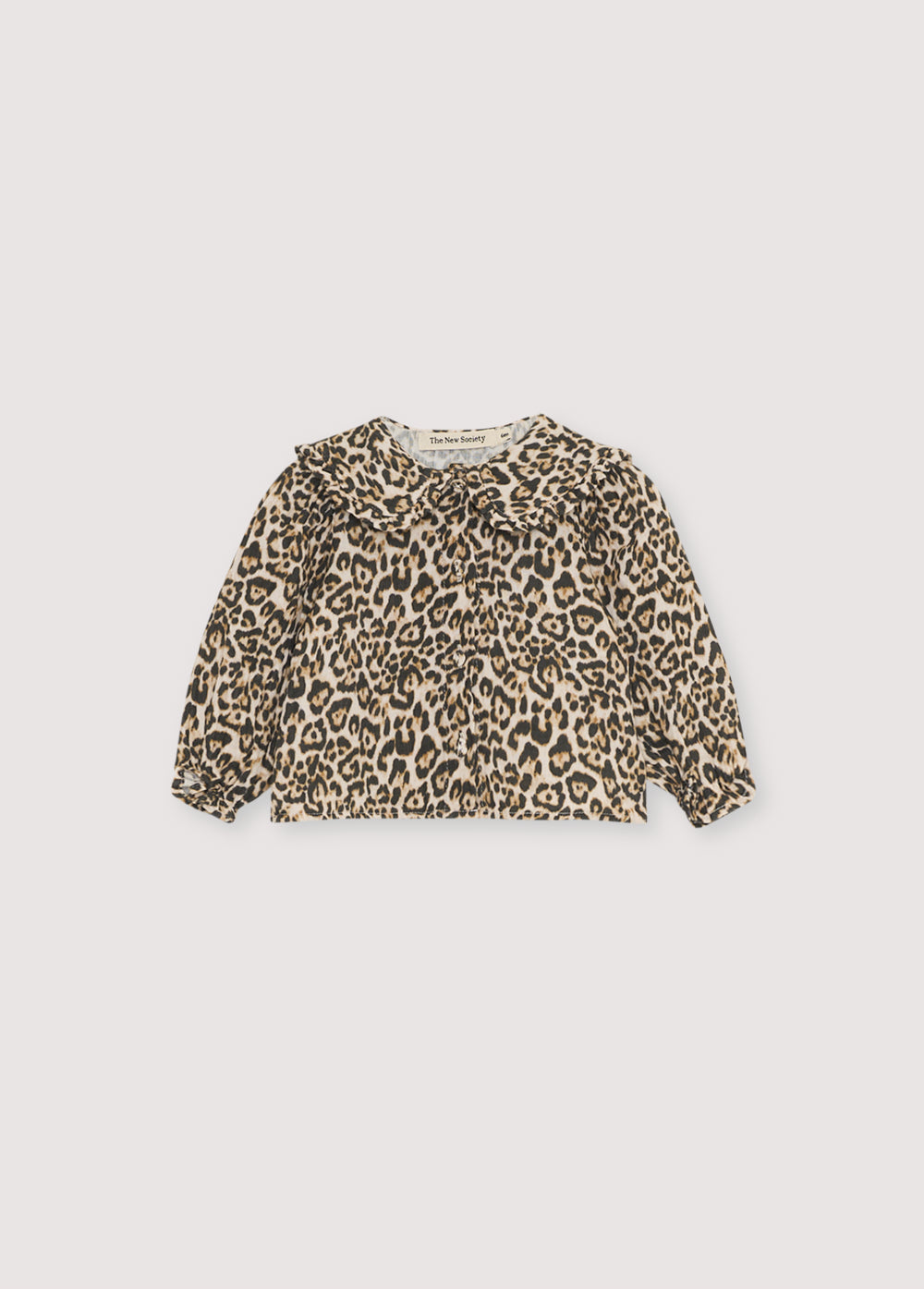 Baby blouse in double gauze with a leopard animal print, featuring a front opening with fabric-covered buttons and a collar detail. You can make the total look with the matching pants