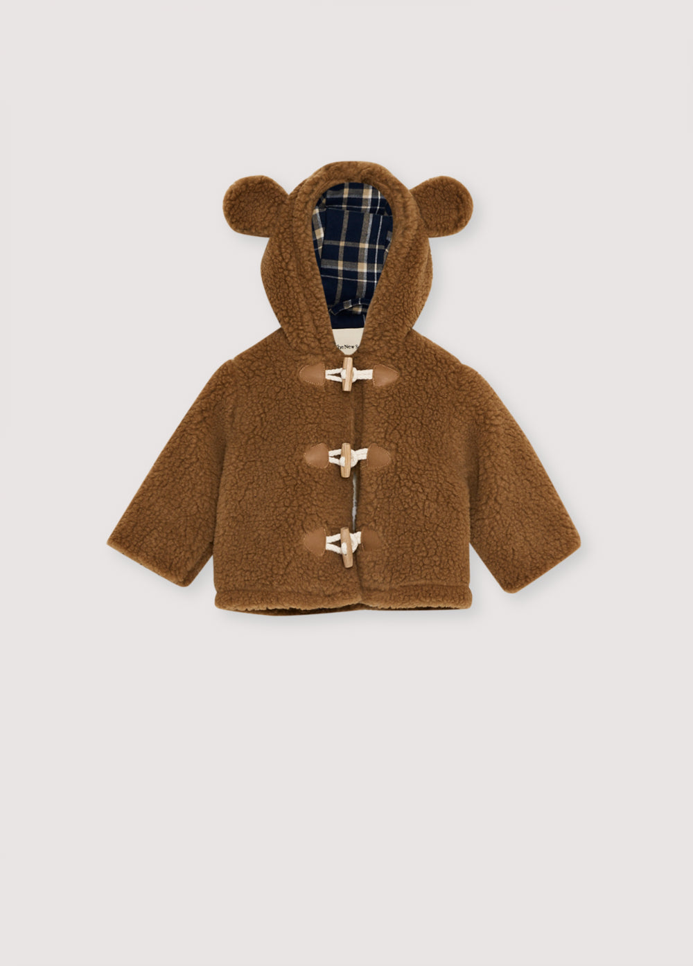 Coat with a hood featuring a fun ear detail and a front closure with wooden toggles. It has a check lining in cotton.