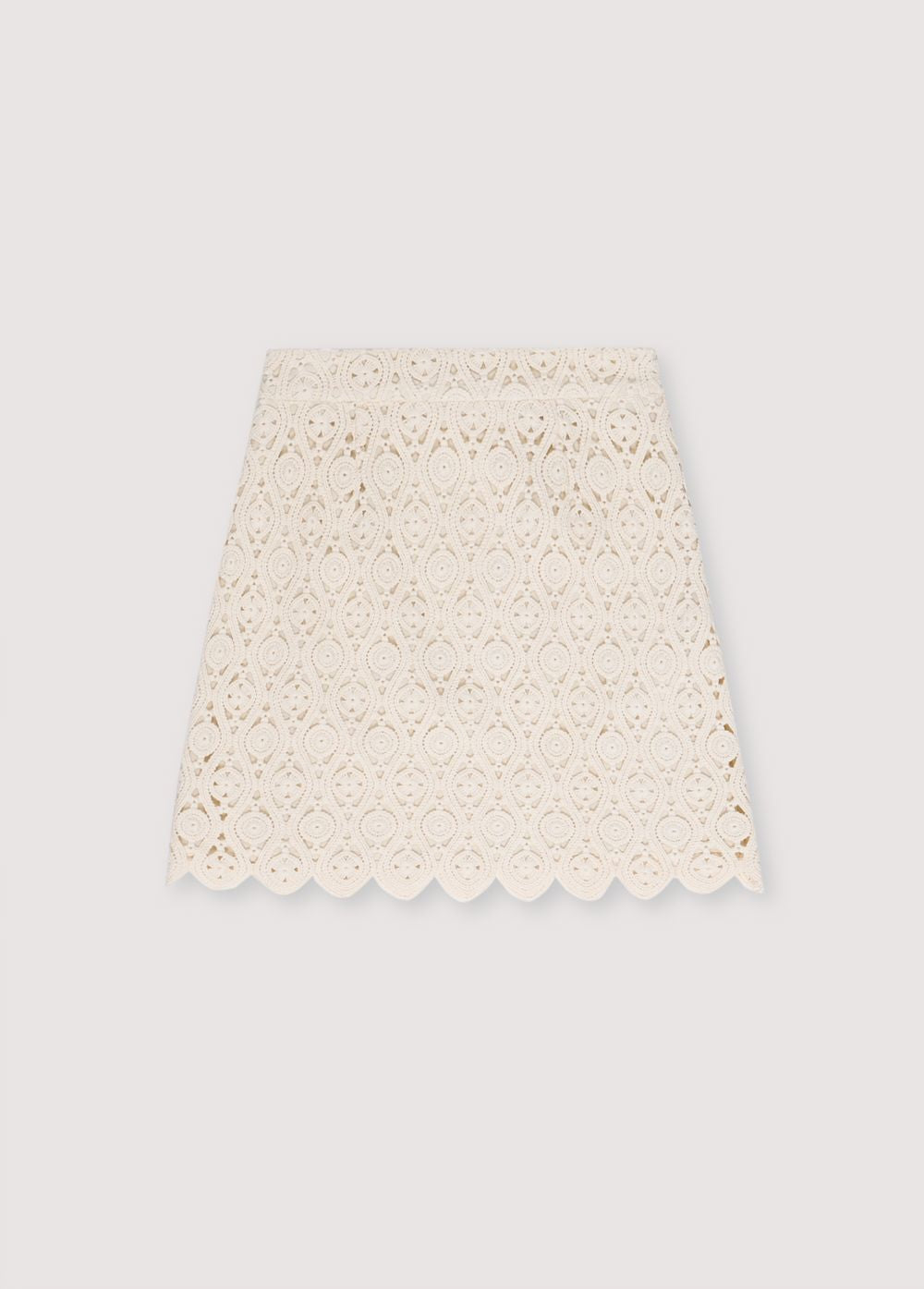 Crochet skirt with inner lining and side slit with invisible zipper. Perfect for creating a coordinated look with the matching top.