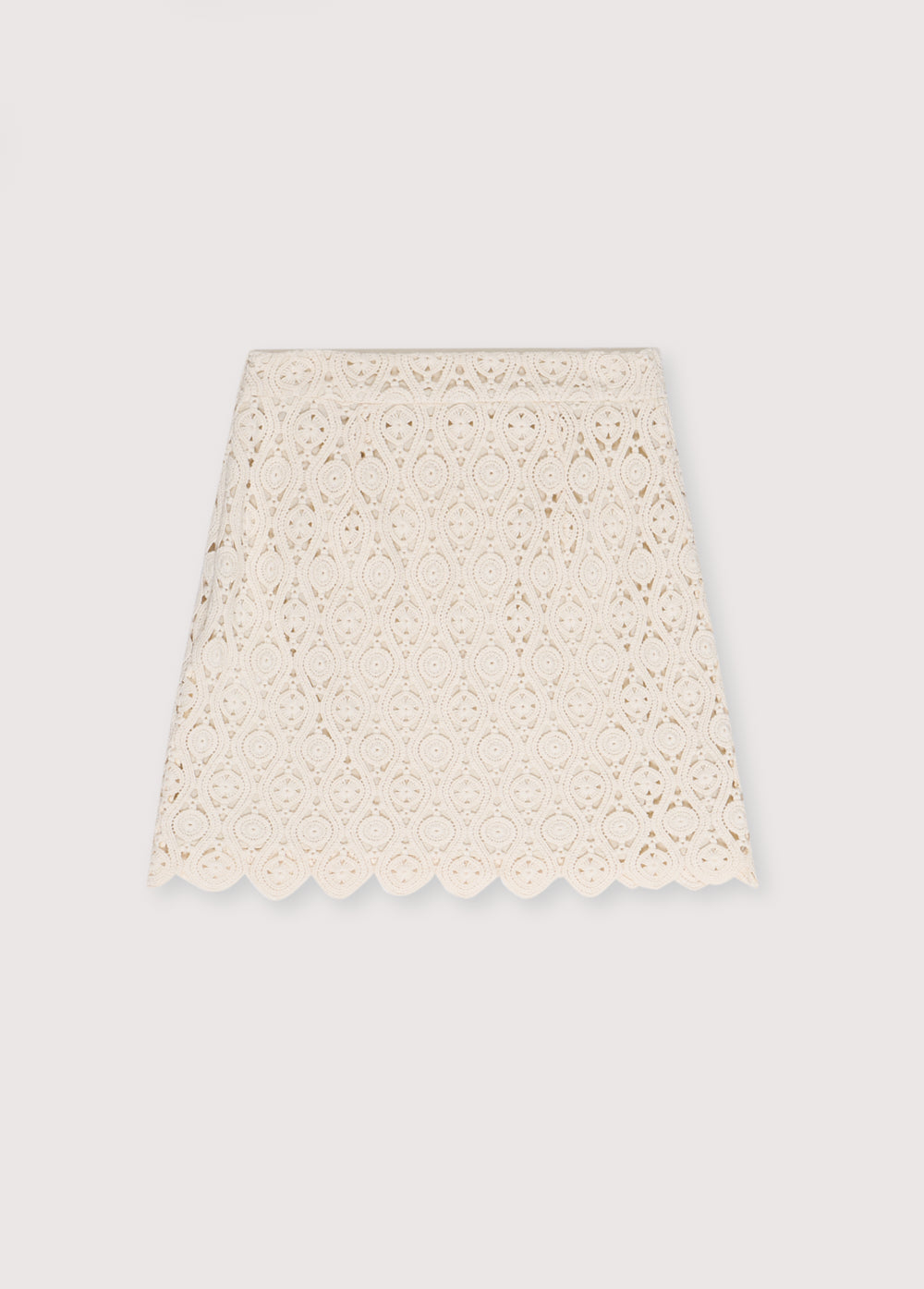 Crochet skirt with inner lining and side slit with invisible zipper. Perfect for creating a coordinated look with the matching top.