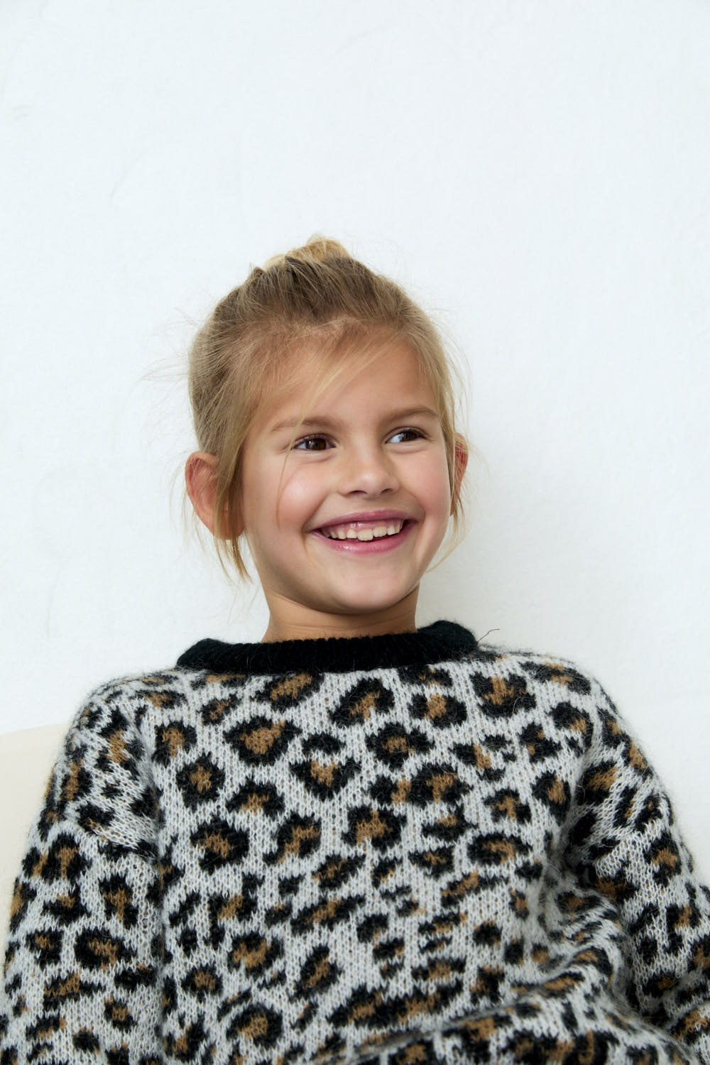 Leopard jacquard sweater made of mohair with contrasting rib details on the cuffs, hem, and neckline.