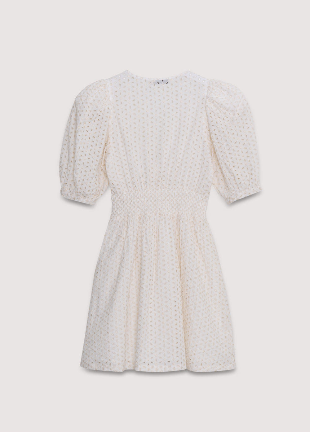 Nemesis Woman Dress in 100% cotton embroidered poplin. It features a V-neck, long billowy sleeves, and a fitted waist. It closes at the front with buttons covered in the same fabric. Spring Summer Collection. The New Society.