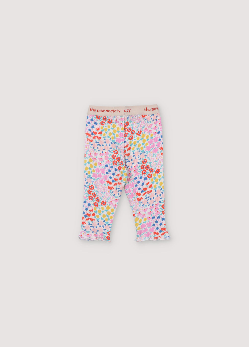 Ribbed leggings with multicolor floral print. They have an elastic waistband with logo in contrast and cuffs finished with baby overlock. It comes with matching tee. Spring Summer Collection. The New Society.