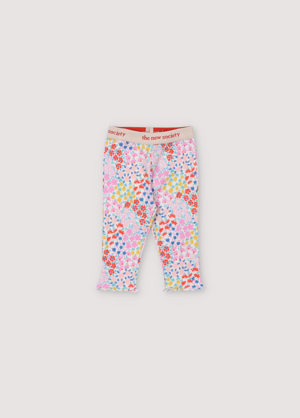 Ribbed leggings with multicolor floral print. They have an elastic waistband with logo in contrast and cuffs finished with baby overlock. It comes with matching tee. Spring Summer Collection. The New Society.