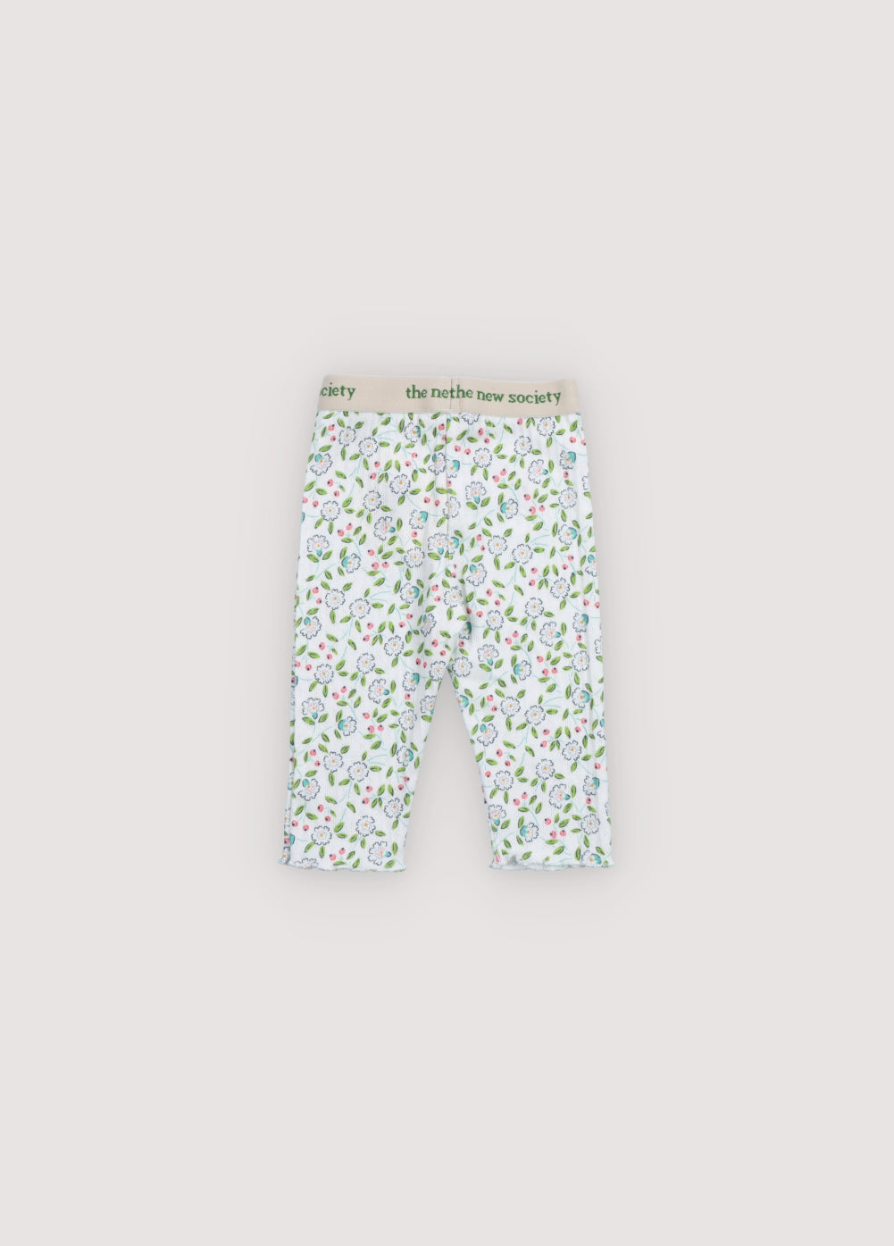 Ribbed openwork leggings with a lovely floral print. They feature an elastic waistband with a contrast logo and finished hem with baby overlock. Perfect to pair with the matching t-shirt. Spring Summer Collection. The New Society.