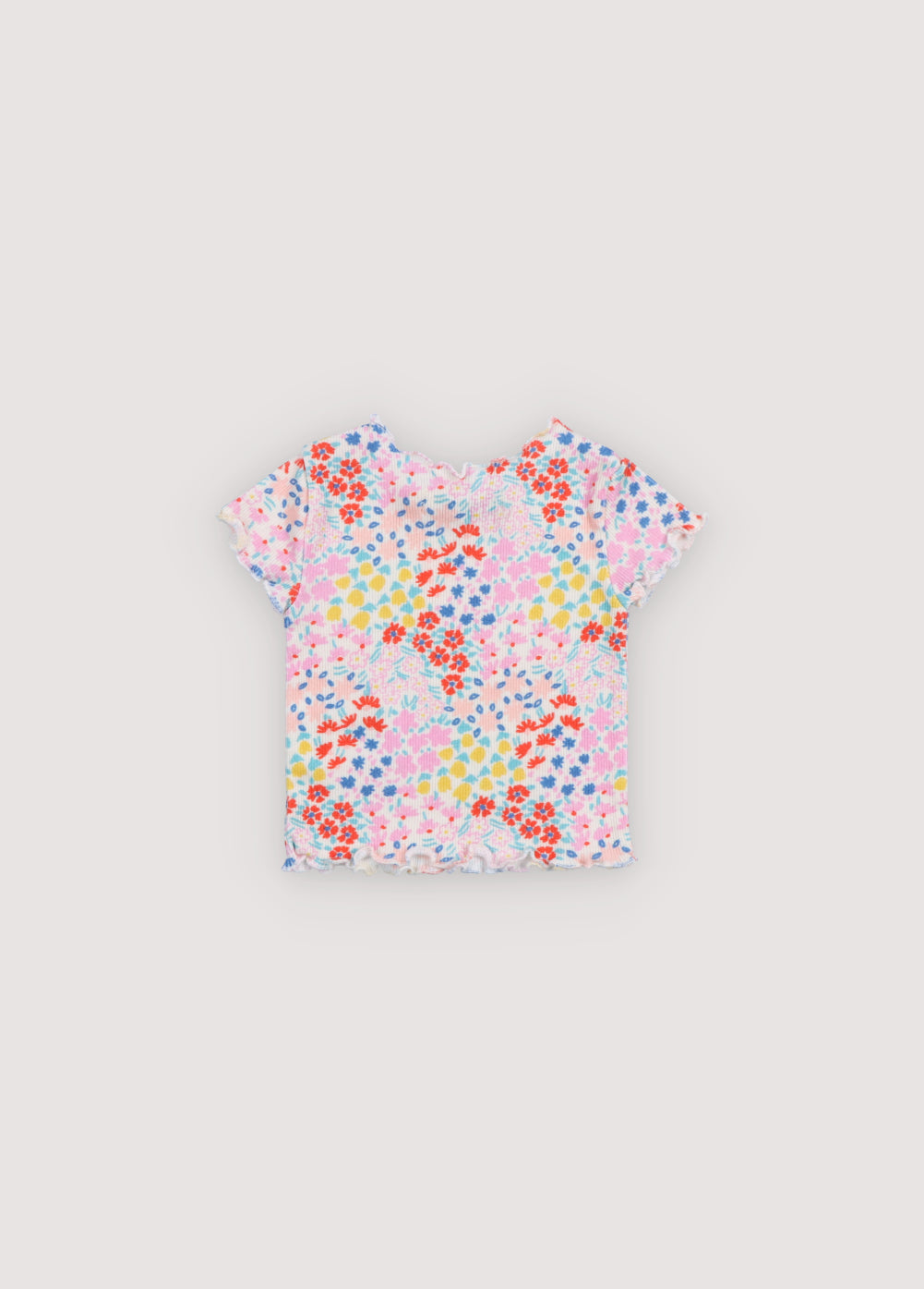 Short-sleeved ribbed t-shirt with multicolor floral print and baby overlock finishes on the collar, cuffs, and hem. It comes with matching leggings. Sprin Summer Collection. The New Society.