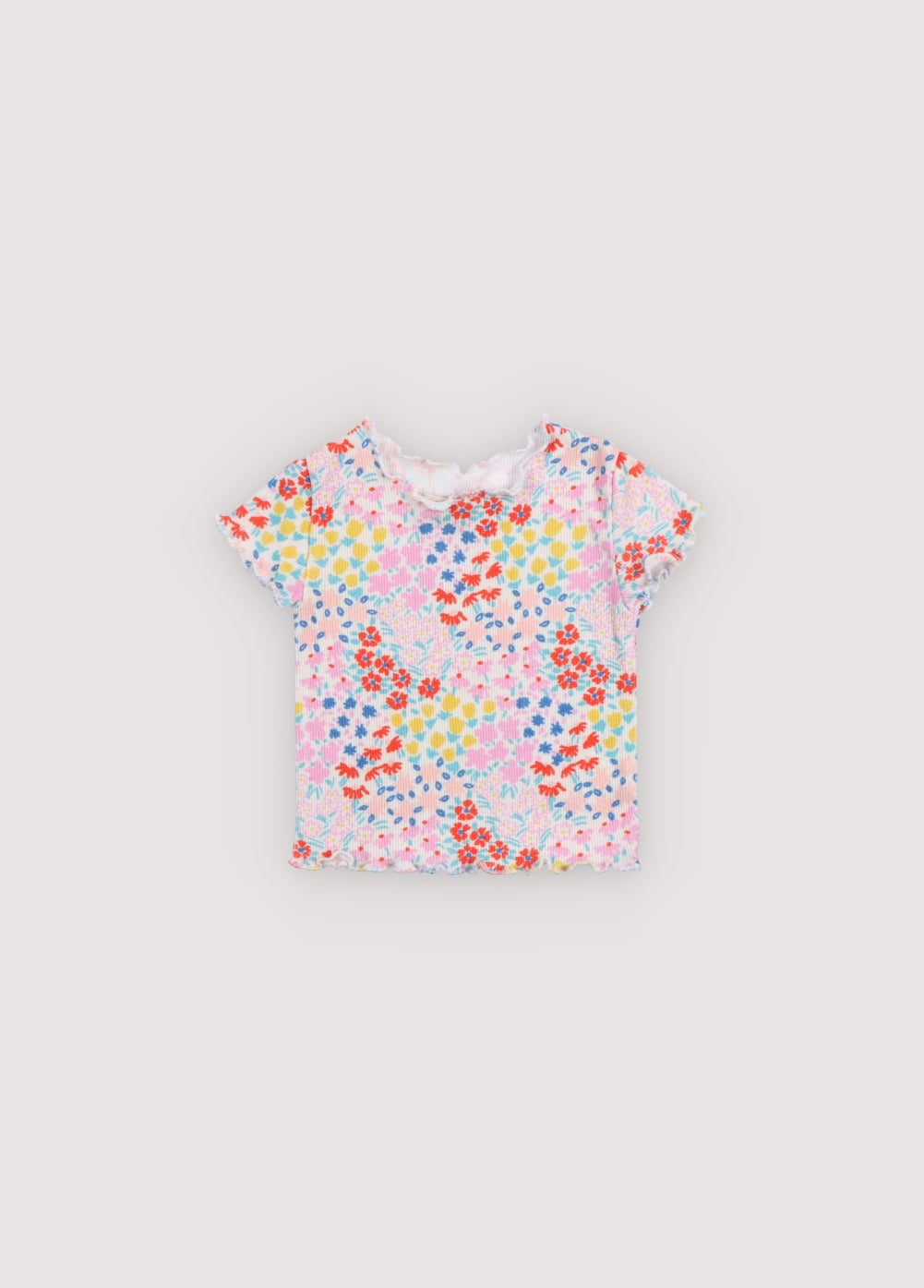 Short-sleeved ribbed t-shirt with multicolor floral print and baby overlock finishes on the collar, cuffs, and hem. It comes with matching leggings. Sprin Summer Collection. The New Society.