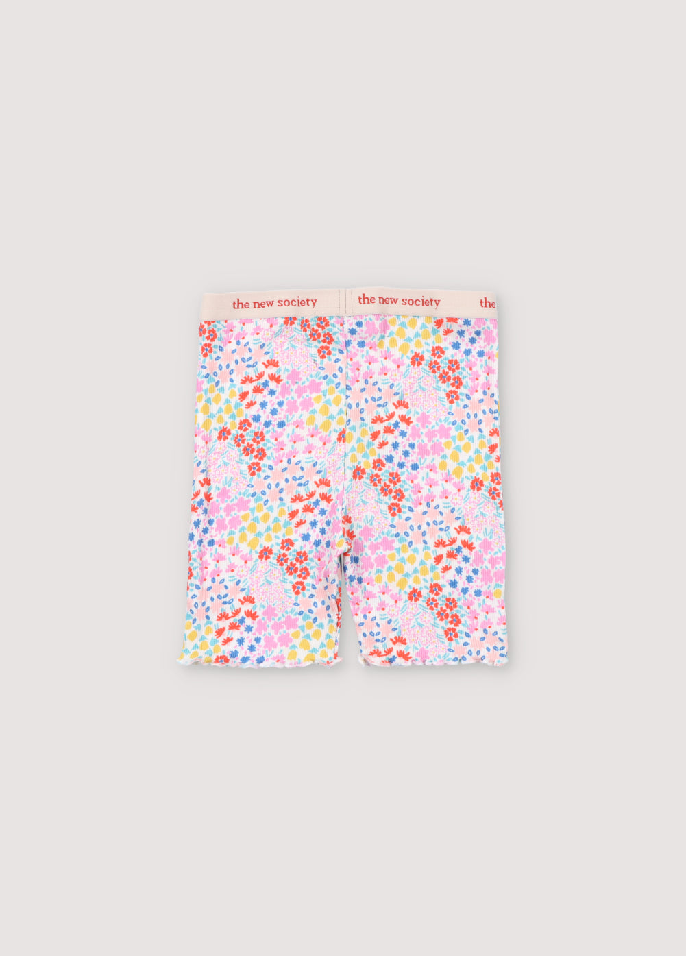 Ribbed biker short with multicolor floral print. They have an elastic waistband with logo in contrast and cuffs finished with baby overlock. It comes with matching tee. Spring Summer Collection. The New Society.