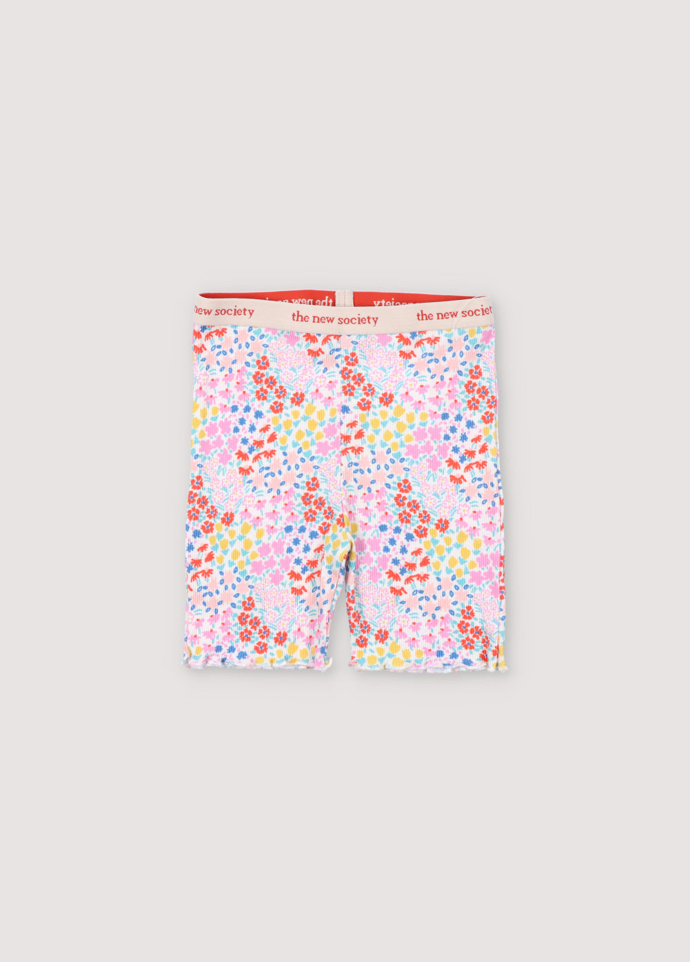 Ribbed biker short with multicolor floral print. They have an elastic waistband with logo in contrast and cuffs finished with baby overlock. It comes with matching tee. Spring Summer Collection. The New Society.