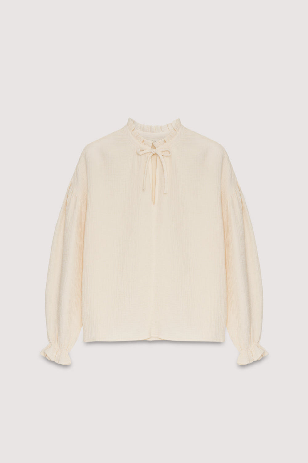 Our classic Olivia Blouse, made from double gauze fabric and available in different colors. It features puffed sleeves and a front keyhole detail with a tie.