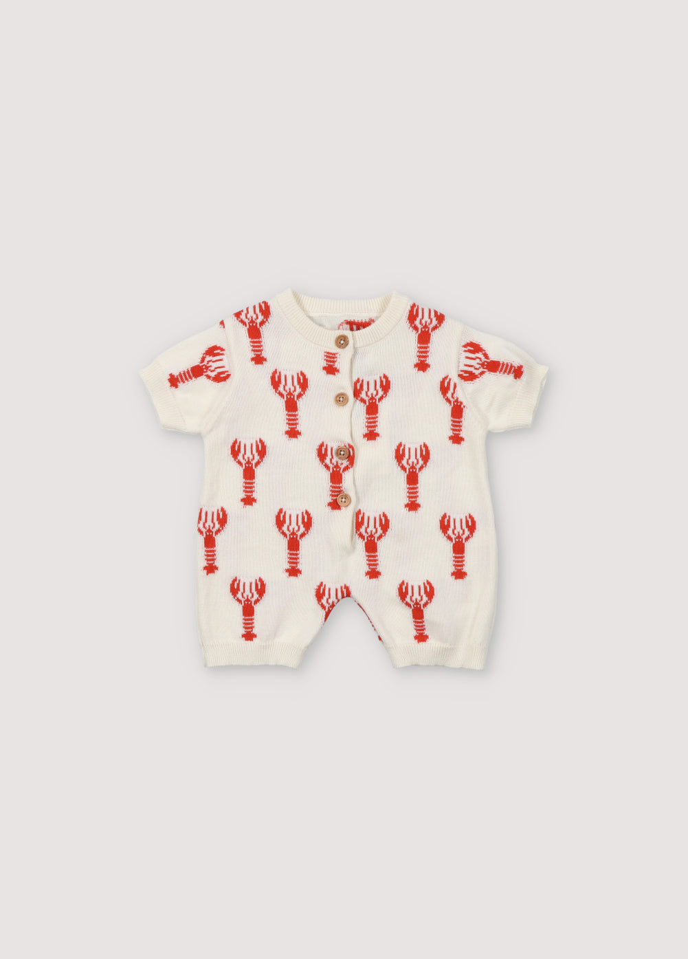 Romper with a fun lobster intarsia pattern and front opening with wooden buttons. Spring Summer Collection .The New Society.
