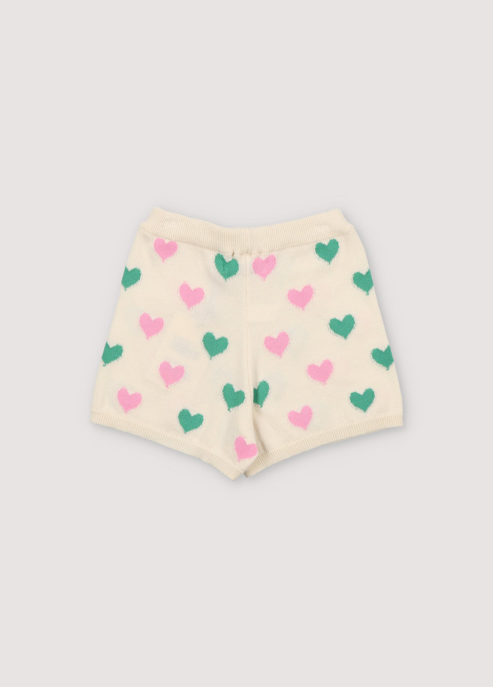 Knit shorts with a playful two-color heart intarsia pattern and ribbed elastic waistband. It has a matching top to create a perfect summer look. Spring Summer Collection. The New Society.