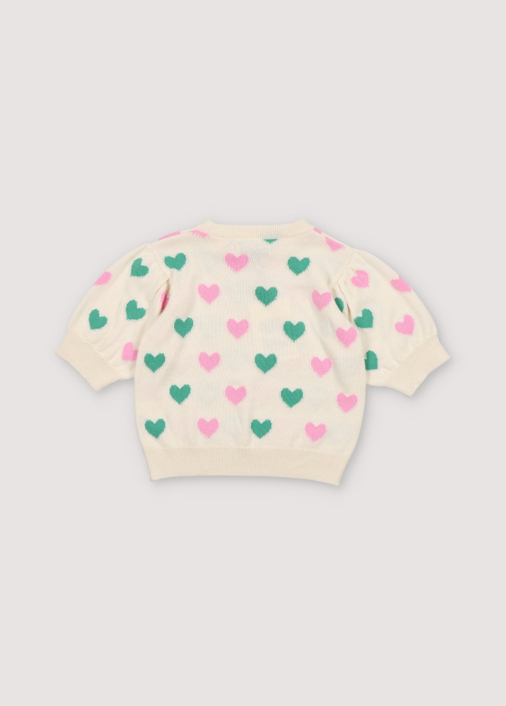 Knit top with a playful heart intarsia pattern and ribbed neckline, cuffs, and hem. It has matching shorts to create a perfect summer look. Spirng Summer Collection. The New Society.