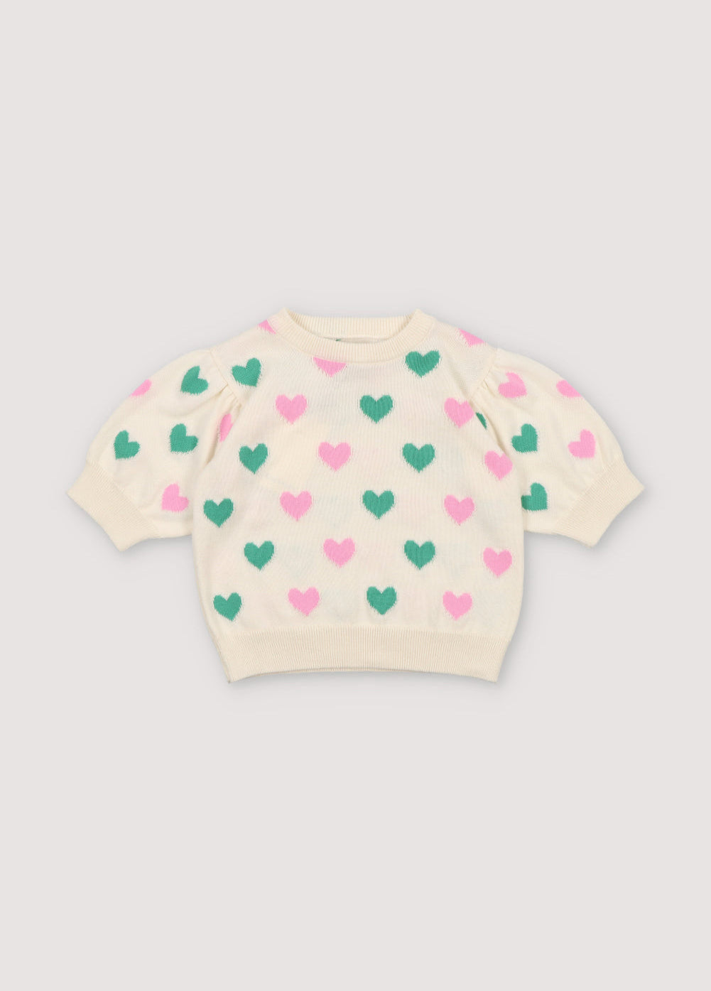 Knit top with a playful heart intarsia pattern and ribbed neckline, cuffs, and hem. It has matching shorts to create a perfect summer look. Spirng Summer Collection. The New Society.