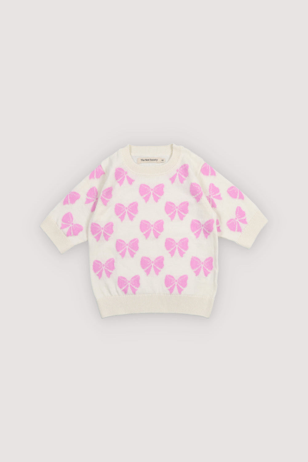 One of our bestselling sets: a fine 100% cotton knit jumper adorned with delicate pink bows and finished with ribbed hem, collar and cuffs.