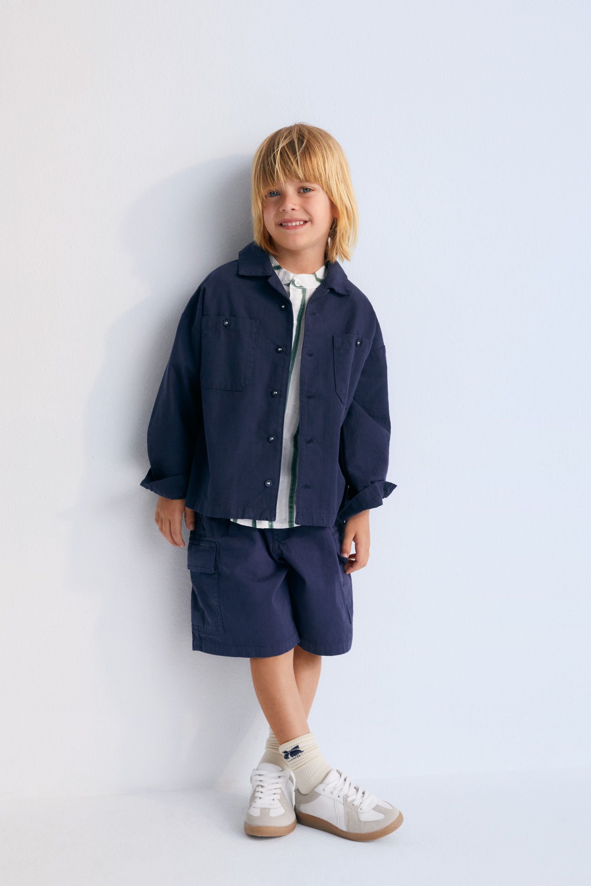 Rodas Overshirt in 100% cotton canvas fabric in navy color with collection embroidery on the back. Spring Summer Collection. The New Society.