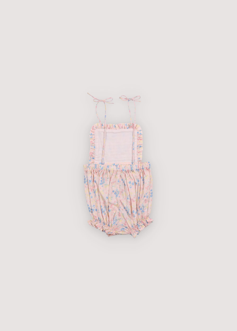 Pelele para bebé confeccionado en 100% algodón orgánico con un encantador estampado floral.