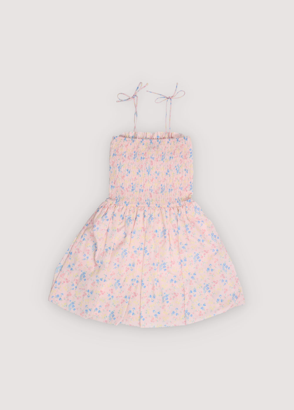 Robe en coton biologique avec un joli imprimé floral, dotée d'un corsage smocké avec une bordure à volants délicats pour une coupe confortable et flatteuse
